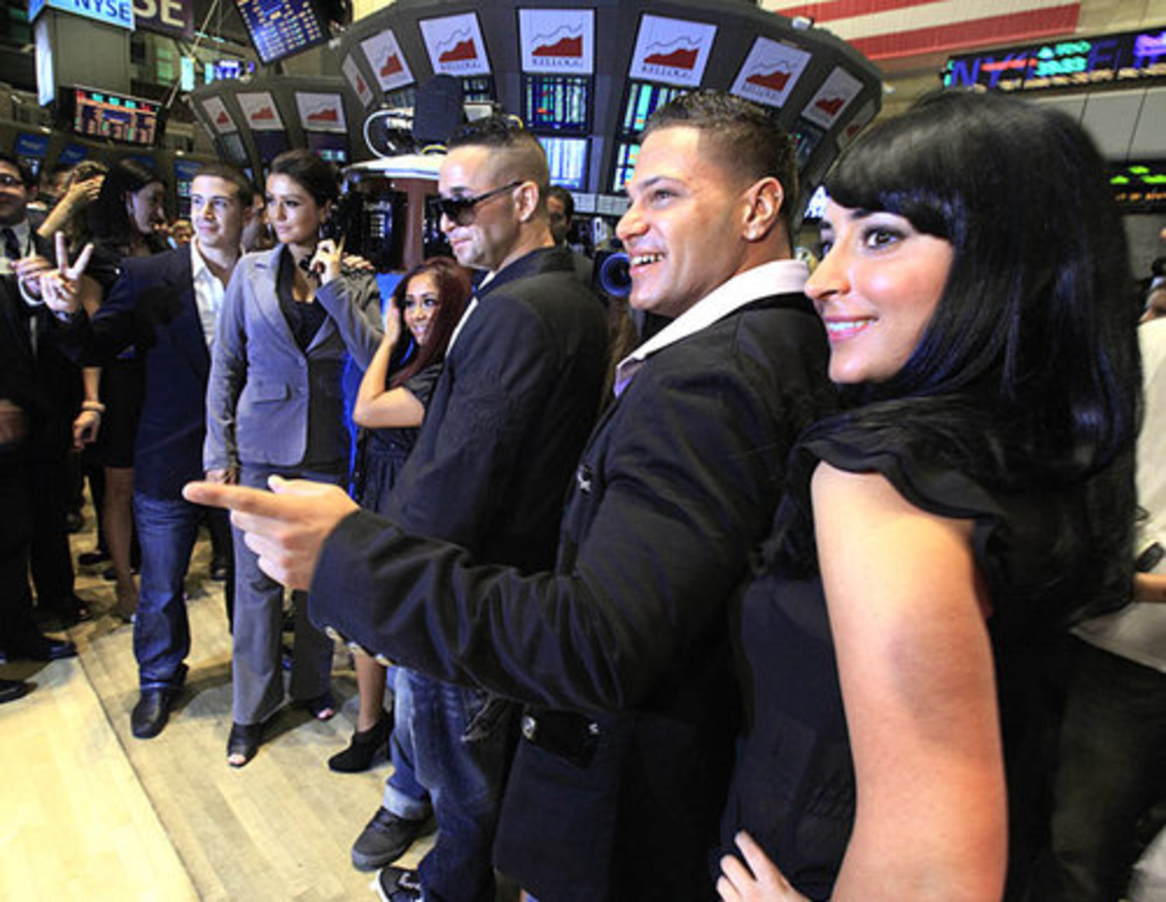 The gang poses one more time on the trading floor, then it's back to the gym, tanning salon and laundromat.