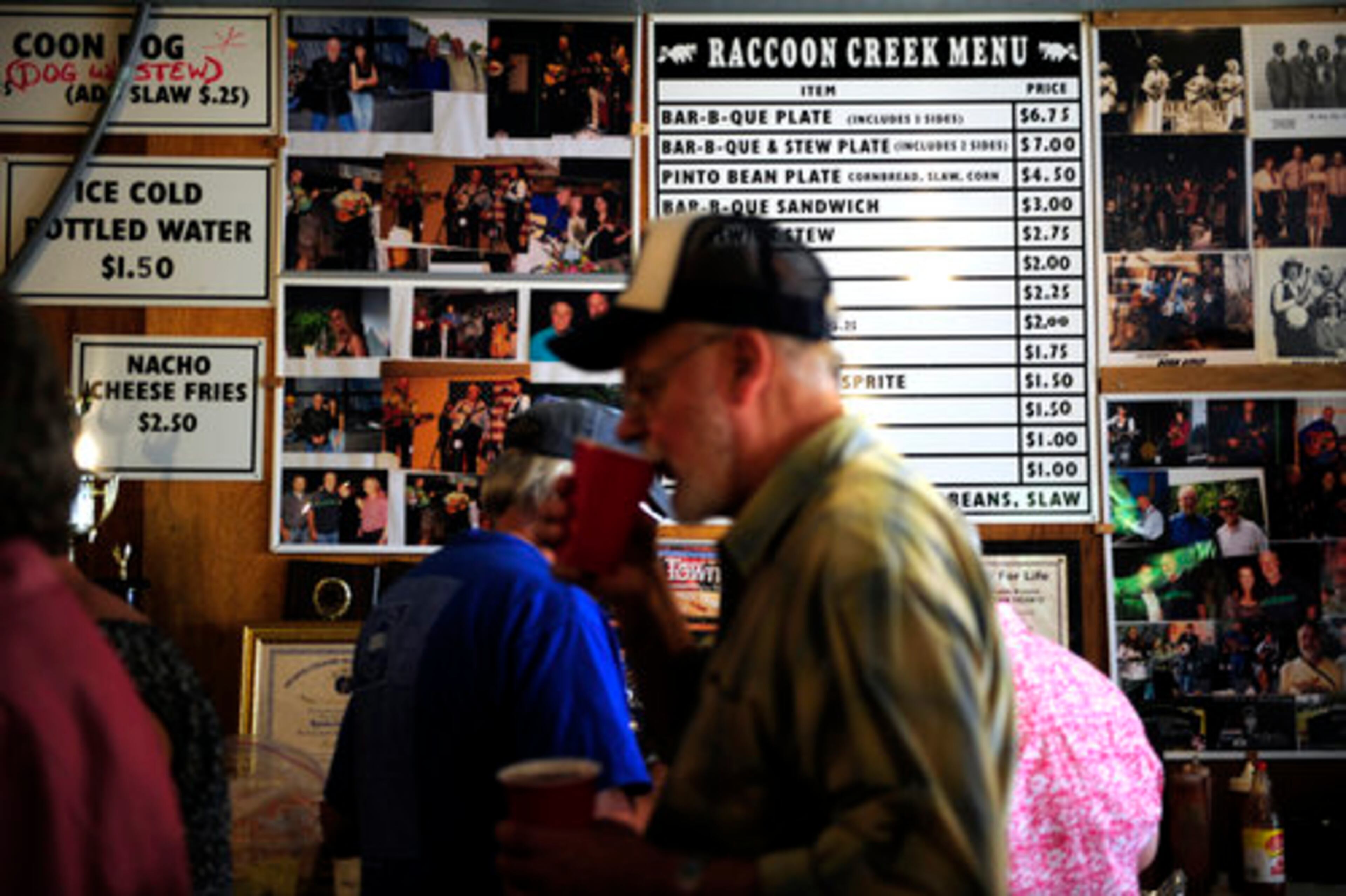 People gather to nosh on bar-b-que and slaw.