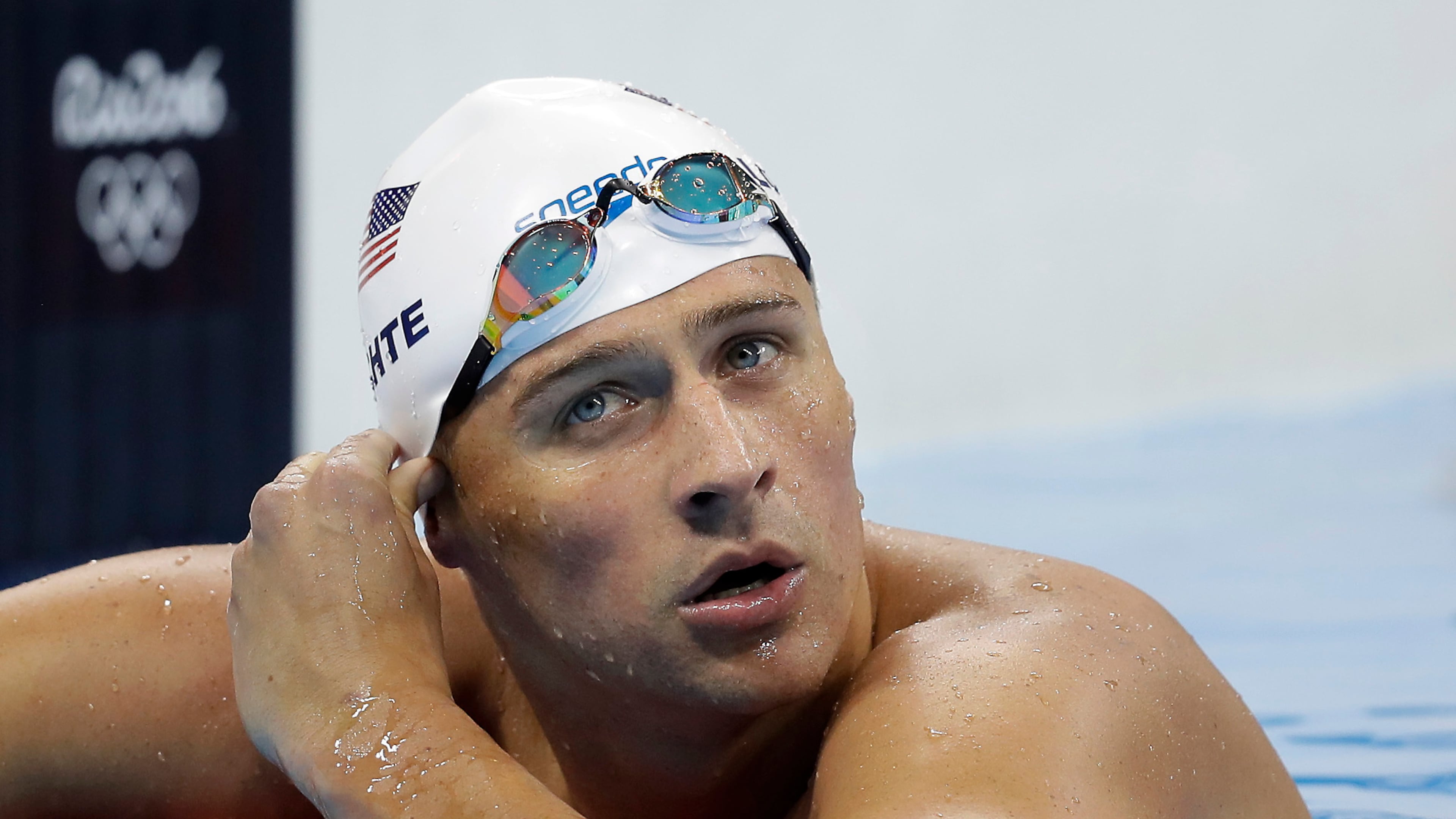 FILE - In this Tuesday, Aug. 9, 2016, file photo, United States' Ryan Lochte checks his time in a men's 4x200-meter freestyle heat during the swimming competitions at the 2016 Summer Olympics, in Rio de Janeiro, Brazil. During an Aug. 30, 2016, appearance on ABC's "Good Morning America," Lochte wouldn't say whether he'd return to Brazil to face charges of filing a false police report over an incident at a gas station during the Games. (AP Photo/Michael Sohn, File)