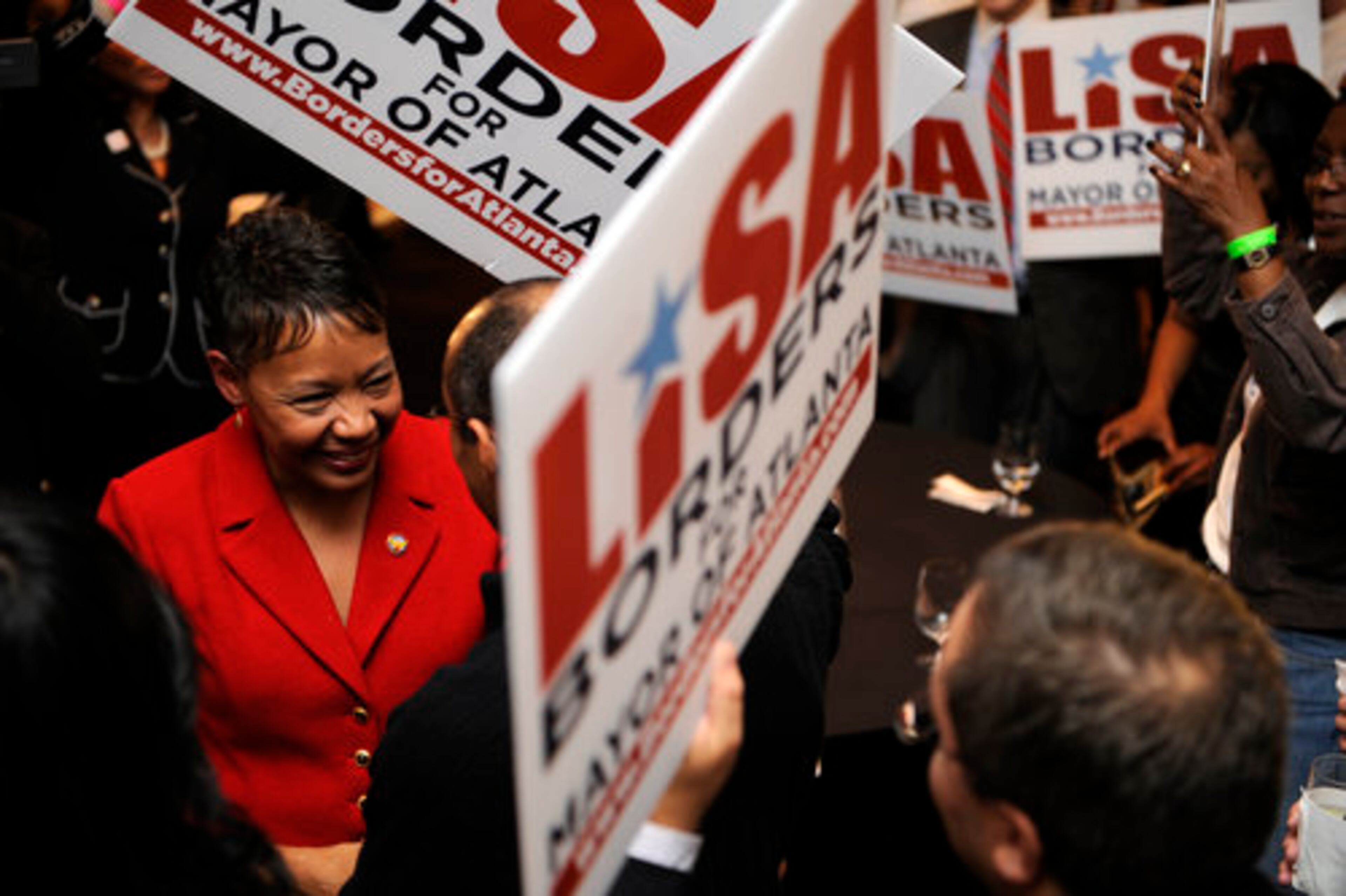 Supporters of Lisa Borders welcome her to the W Hotel in downtown Atlanta.