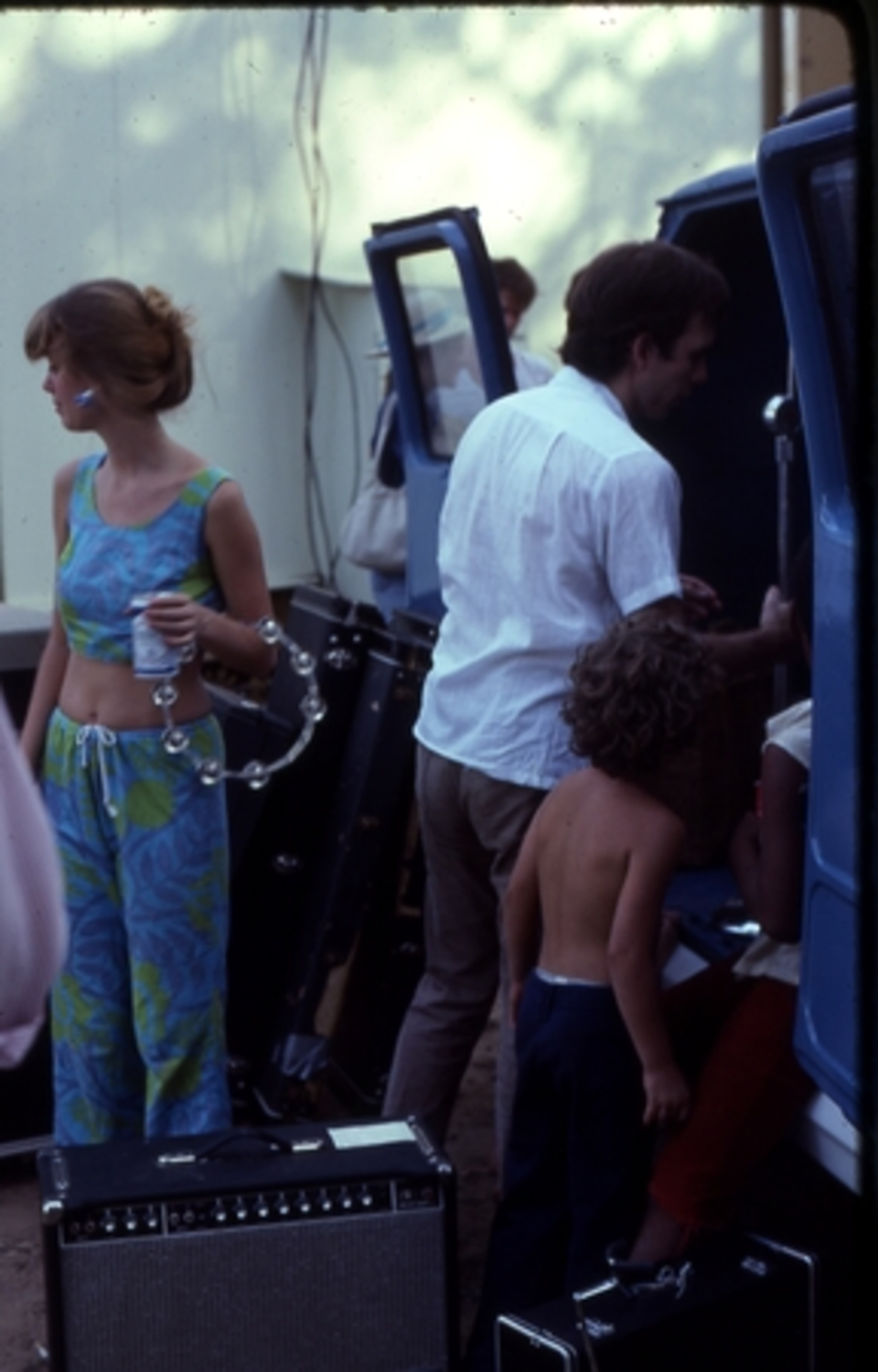Cindy Wilson of the B-52's and Danny Beard of Wax 'n Facts and DB Records load up at the Piedmont Park Amplitheatre after a B-52's concert in the park, summer 1978.