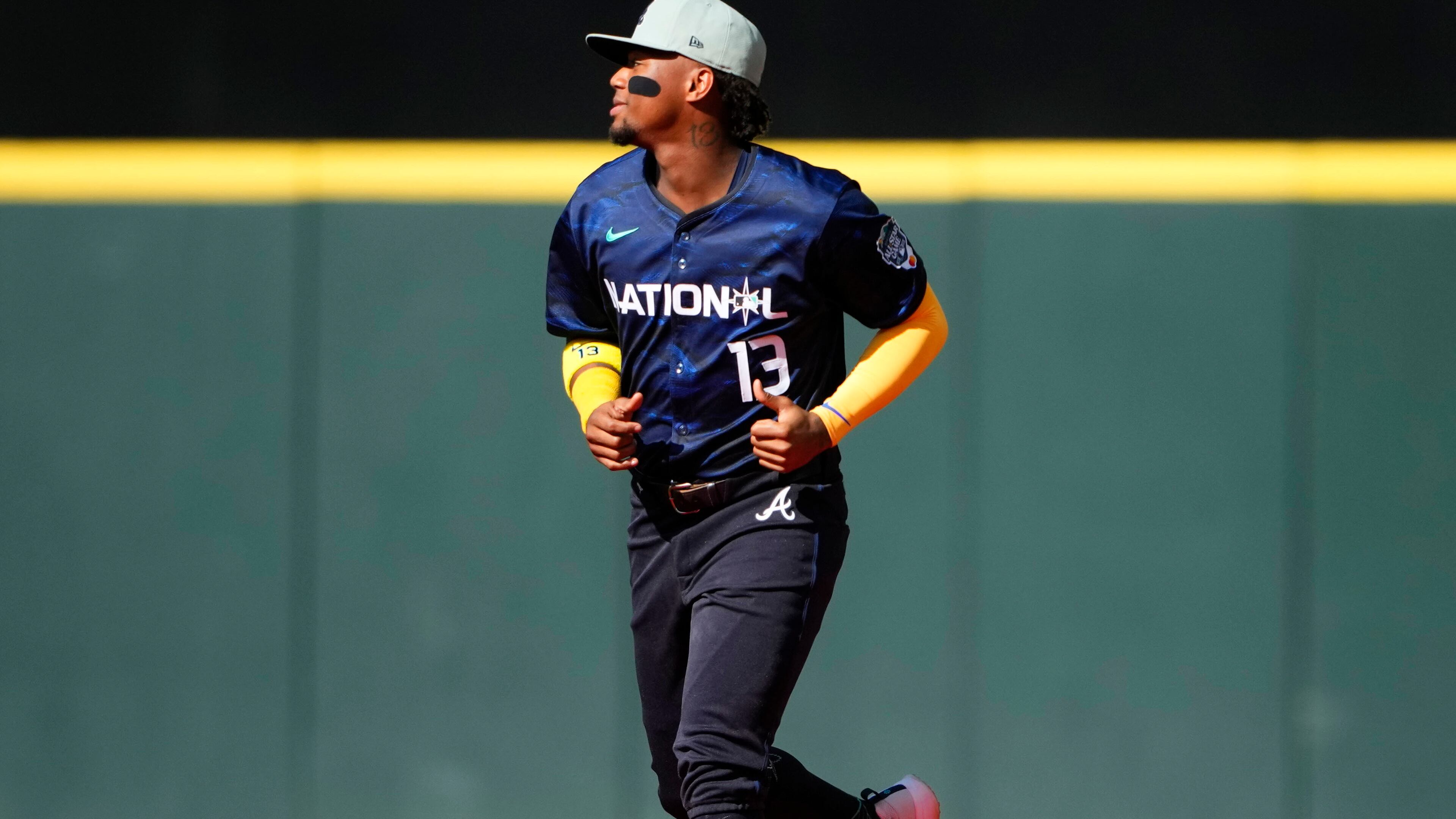 National League's Ronald Acuña Jr., of the Atlanta Braves (13) runs onto the field before the MLB All-Star baseball game in Seattle, Tuesday, July 11, 2023. (AP Photo/Lindsey Wasson)