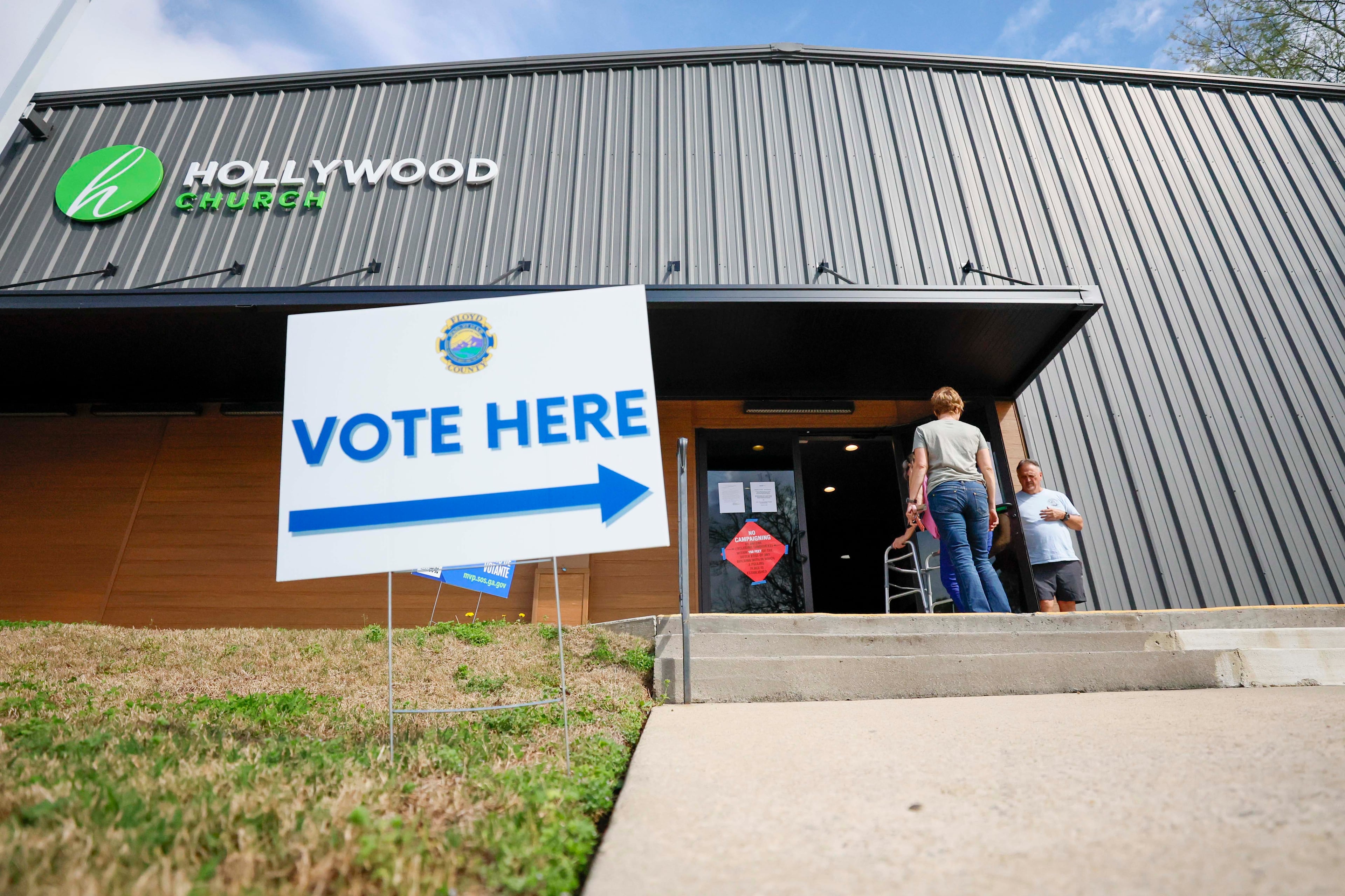 Voters enter and exit the Hollywood Baptist Church during the special election to replace Marjorie Taylor Greene in U.S. House District 14 in March. (Miguel Martinez/AJC)