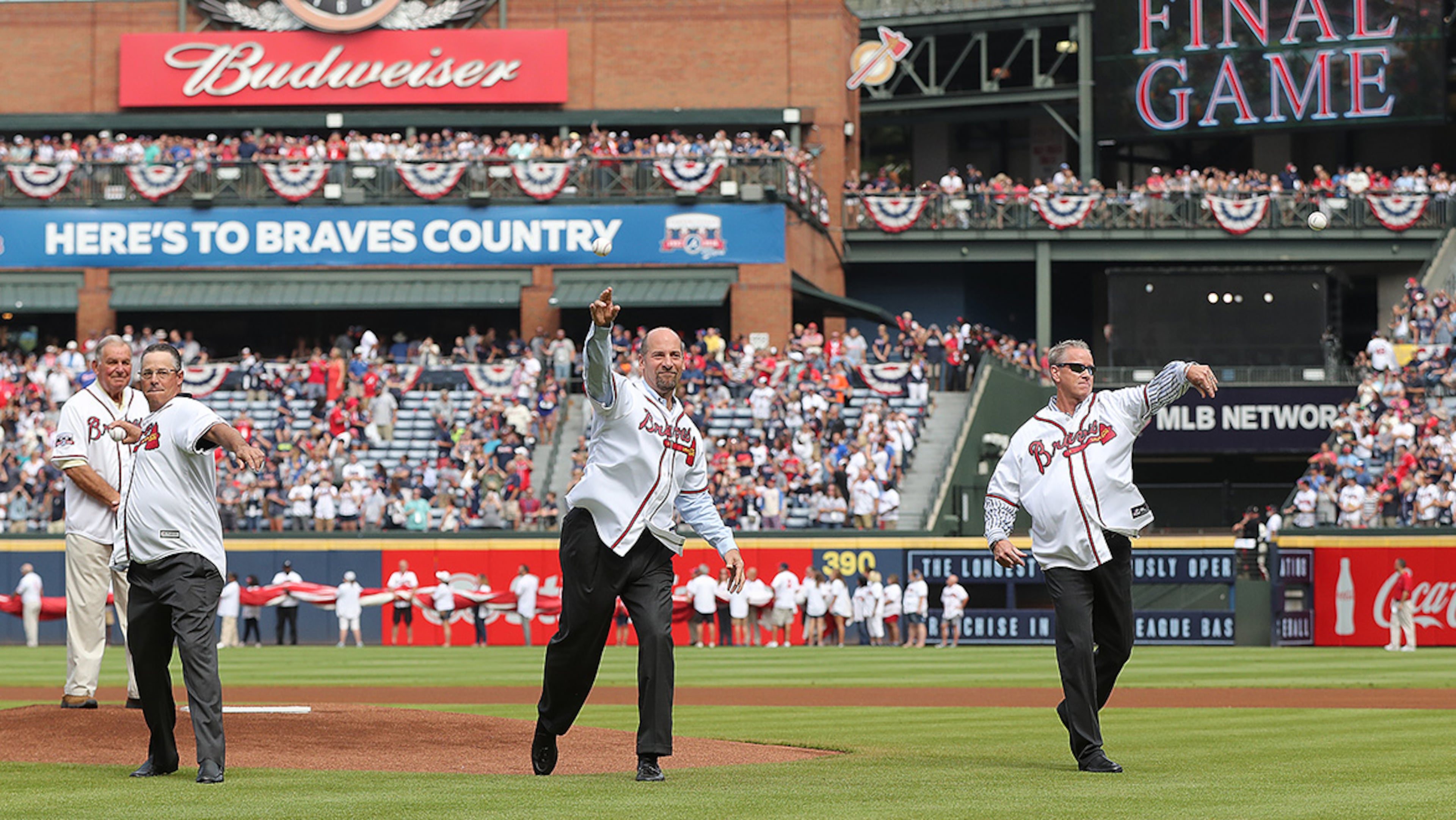 Hall of Fame manager Bobby Cox (from left) looks on as Hall of Fame pitchers Greg Maddux, John Smoltz, and Tom Glavine throw out the first pitch for the Braves final game at Turner Field on Sunday, Oct. 2, 2016, in Atlanta. The team will move to a new stadium in Cobb County for the 2017 season.