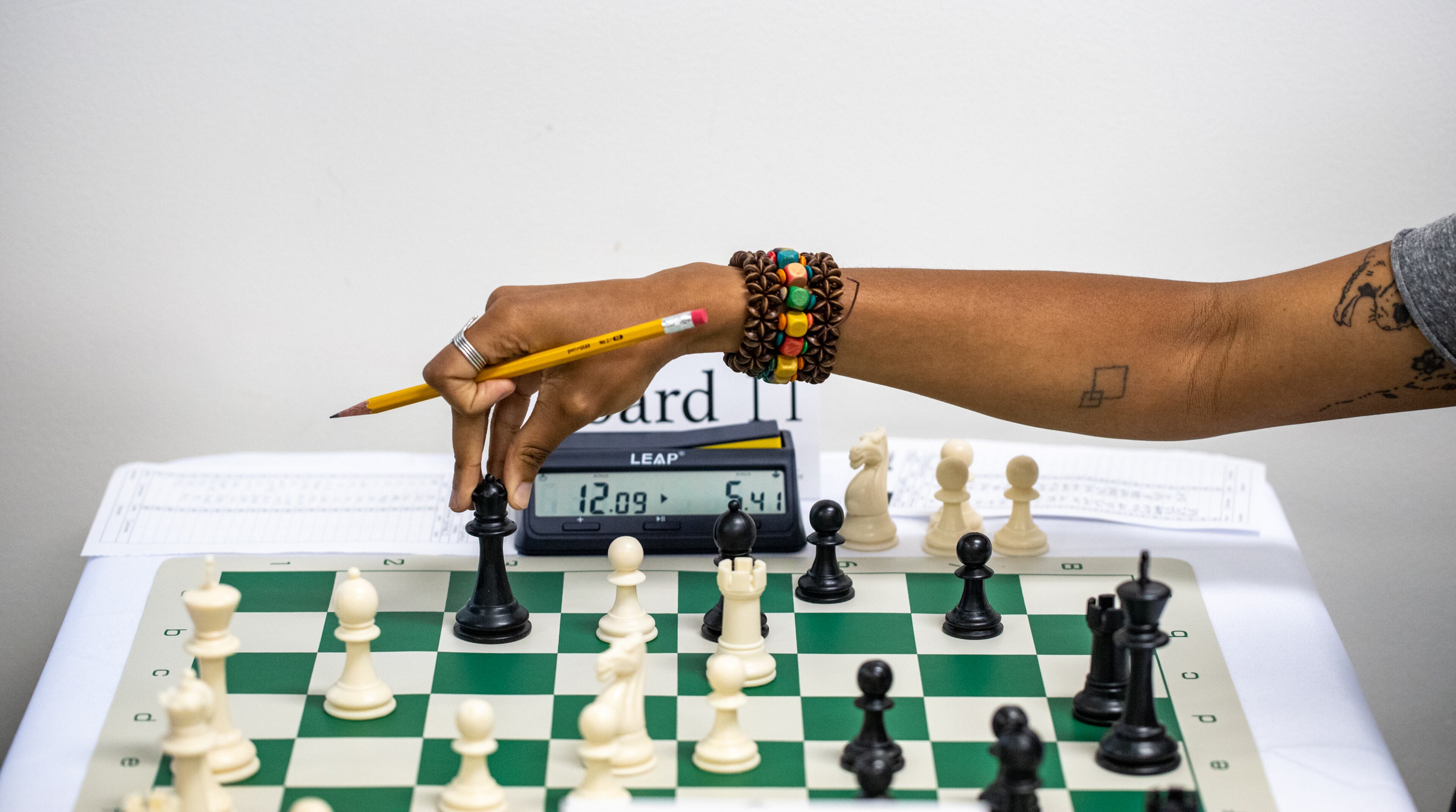 Iyanla Maxwell Savage takes a moment to check her move before letting go during the first round of the inaugural HBCU Chess Classic at Morris Brown College on Saturday, April 22, 2023. The tournament brought together students from Morehouse, Howard University, Spelman and other historically black colleges and universities. (Jenni Girtman for The Atlanta Journal-Constitution)