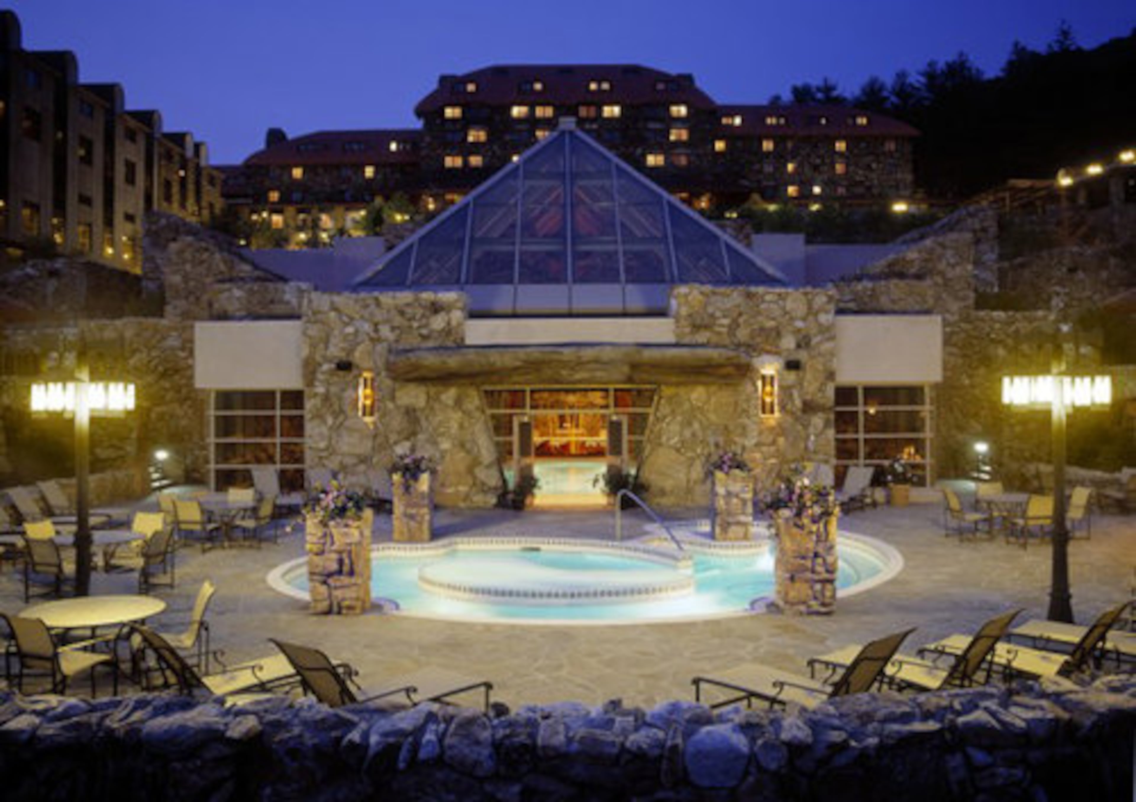 GROVE PARK INN, Asheville, N.C.: The AAA Four Diamond resort overlooks Asheville's skyline and the Blue Ridge Mountains. The original section was constructed in 1912-1913 -- the inn is on the National Register of Historic Places. The original Arts and Crafts look of the interior remains strong. The Grove Park is among Travel + Leisure's Top Five Spa Resorts in the United States. The National Gingerbread House competition/display is on view through Jan. 2. The inn displays around 100 trees.