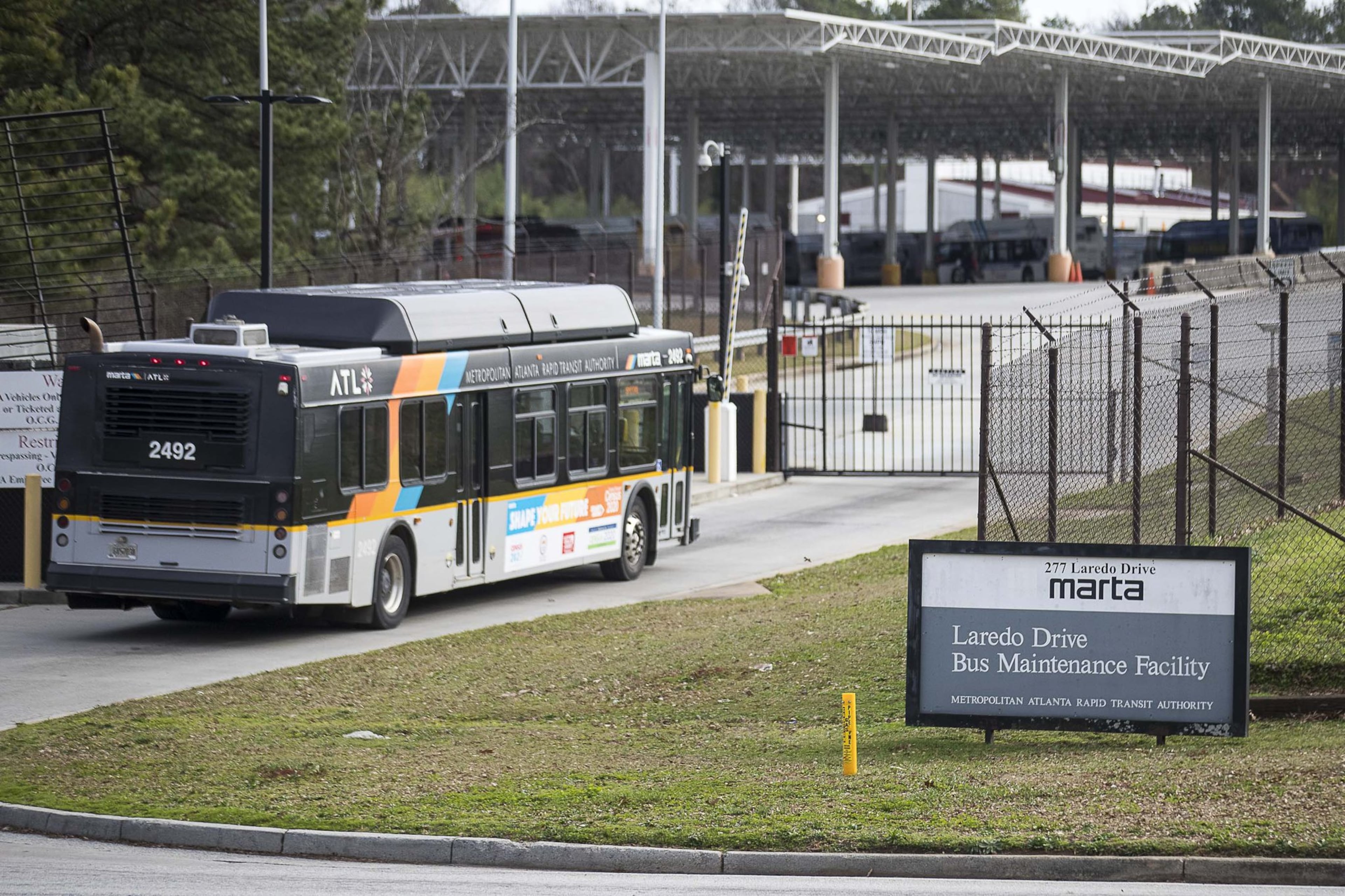 MARTA employee Shyanne Lord is suing the agency, claiming that while she worked at the Laredeo Drive bus garage, pictured here, she endured sexual harassment from a co-worker on a near-daily basis. After she lodged a formal complaint, she says MARTA discounted her claims and retaliated by transferring her to a less-desirable garage. ALYSSA POINTER / ALYSSA.POINTER@AJC.COM