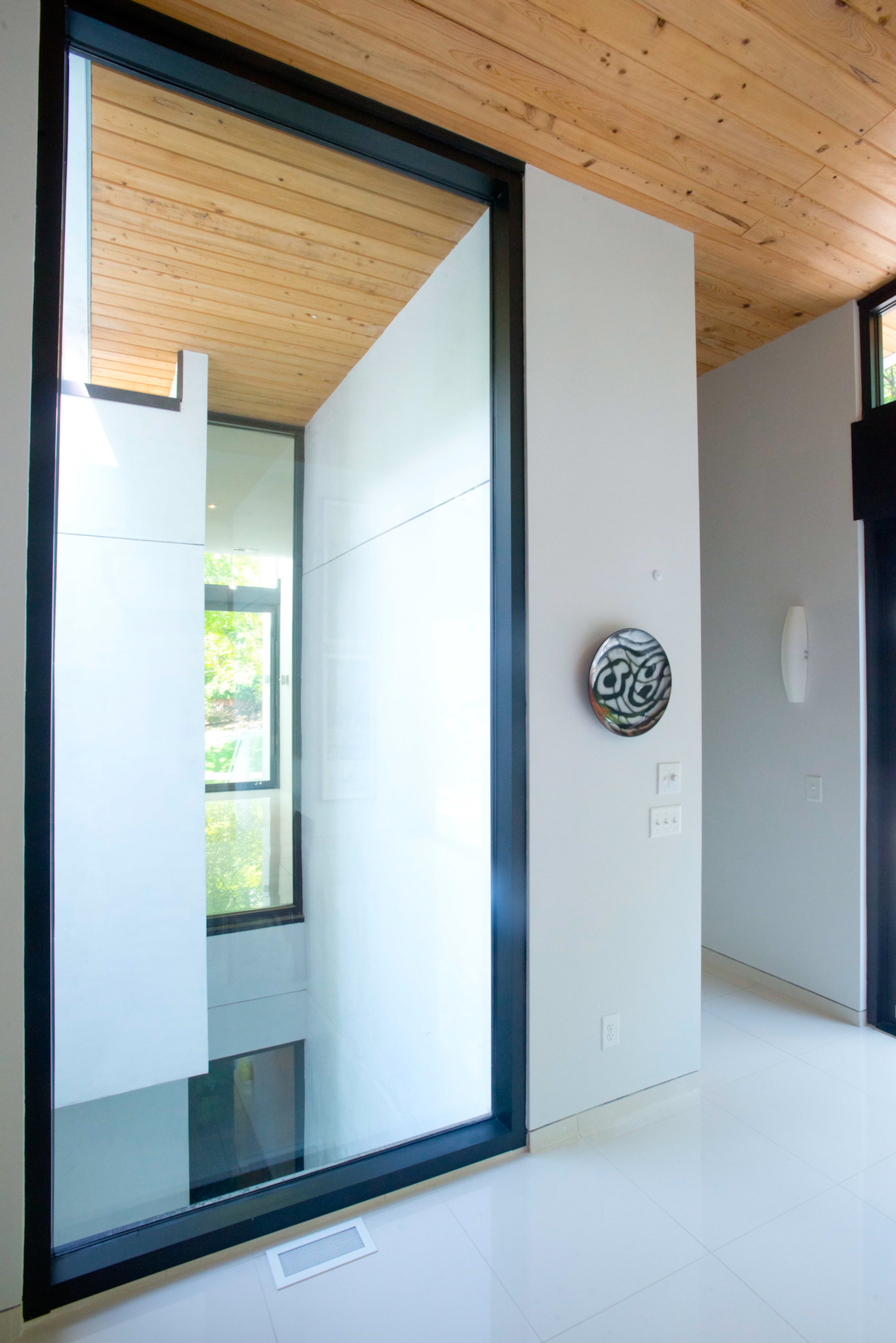 The couple, who moved from a loft in downtown Roswell with 26-foot ceilings and open living space, desired to maintain those elements in their new home.