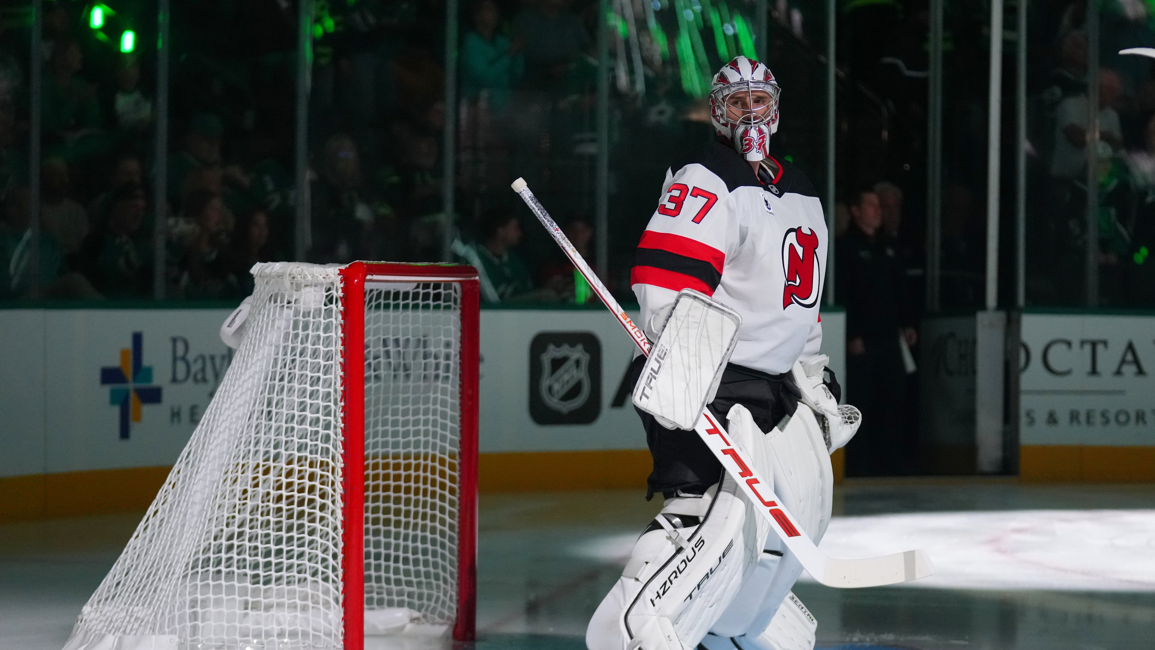 New Jersey Devils goaltender Connor Hellebuyck takes the ice prior to an NHL hockey game against the New Jersey Devils, Tuesday, Oct. 27, 2026, in Dallas. (AP Photo/Julio Cortez)
