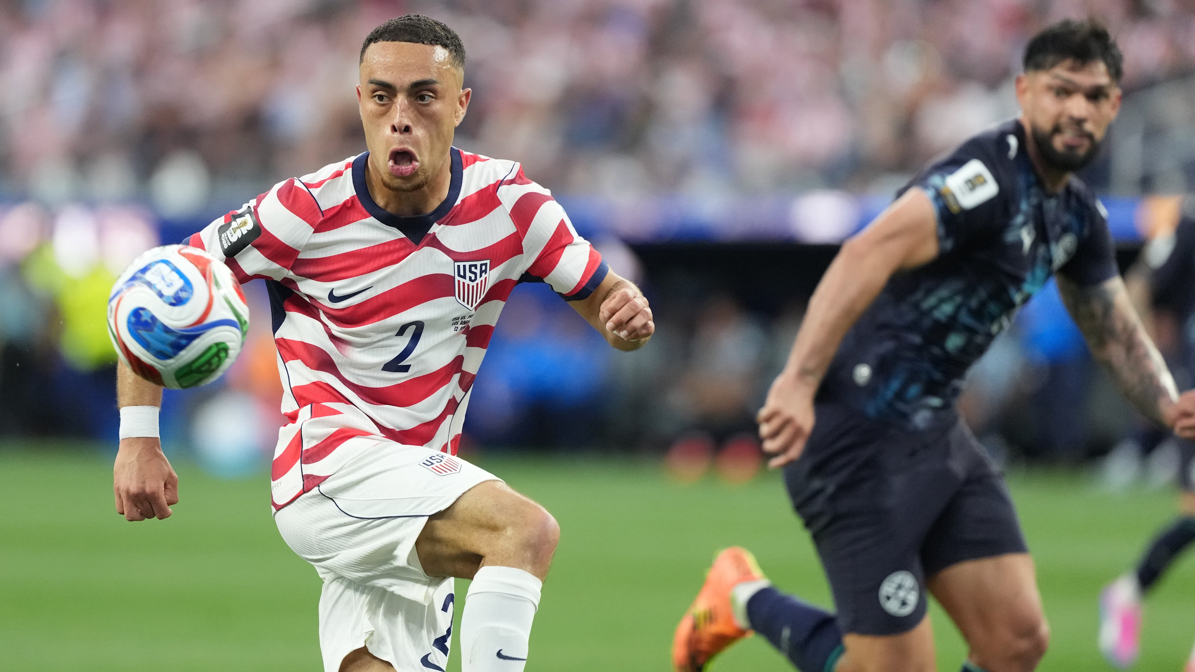 United States' Sergino Dest, left, controls a ball next to Paraguay's Omar Alderete during the World Cup Group D soccer match in Inglewood, Calif., near Los Angeles, Friday, June 12, 2026. (AP Photo/Jae C. Hong)