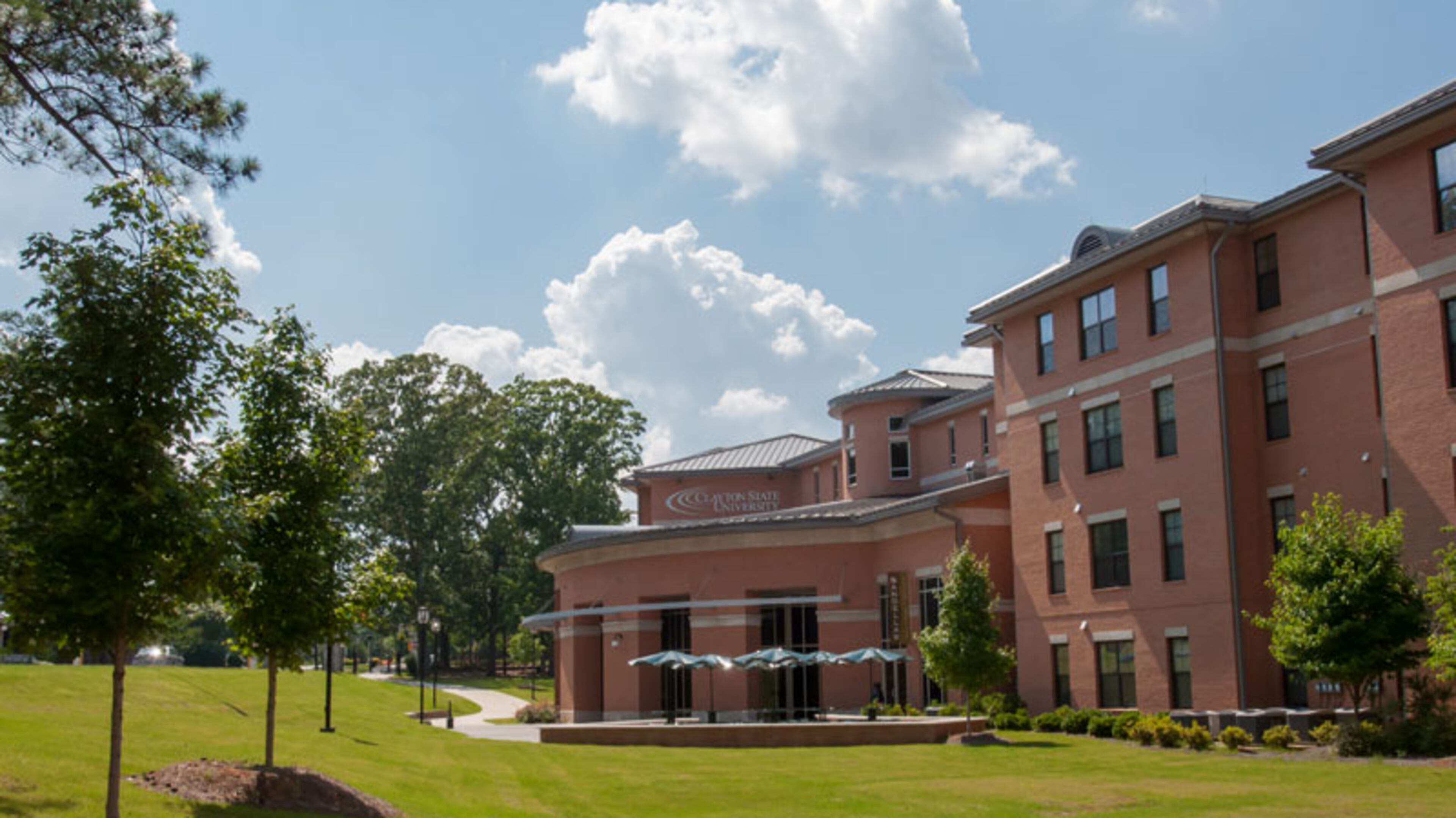 Authorities are searching for four people after a Clayton State University student was shot Saturday morning in a school dormitory.