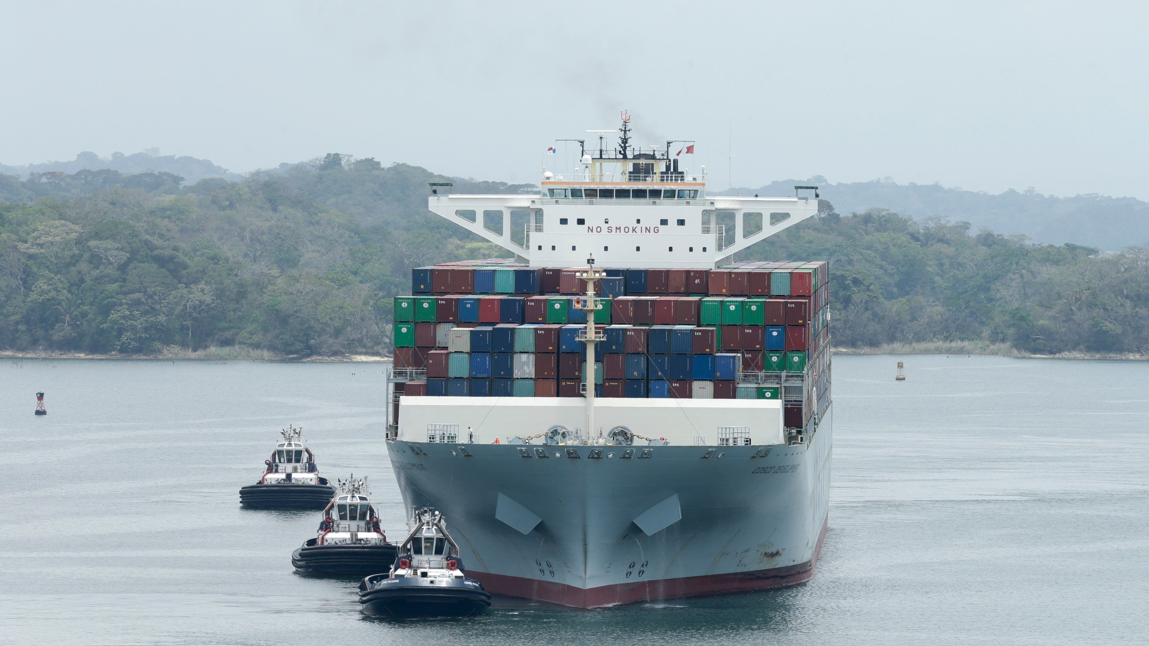 The Neopanamax Cosco Development cargo ship sails in Gatun Lake as it lines up to make it through Agua Clara locks on the newly expanded Canal in, Panama, Tuesday, May, 2, 2017. The Cosco Development is the biggest ship that has gone through the expanded Canal since its inauguration on June 2016. (AP Photo/Arnulfo Franco)