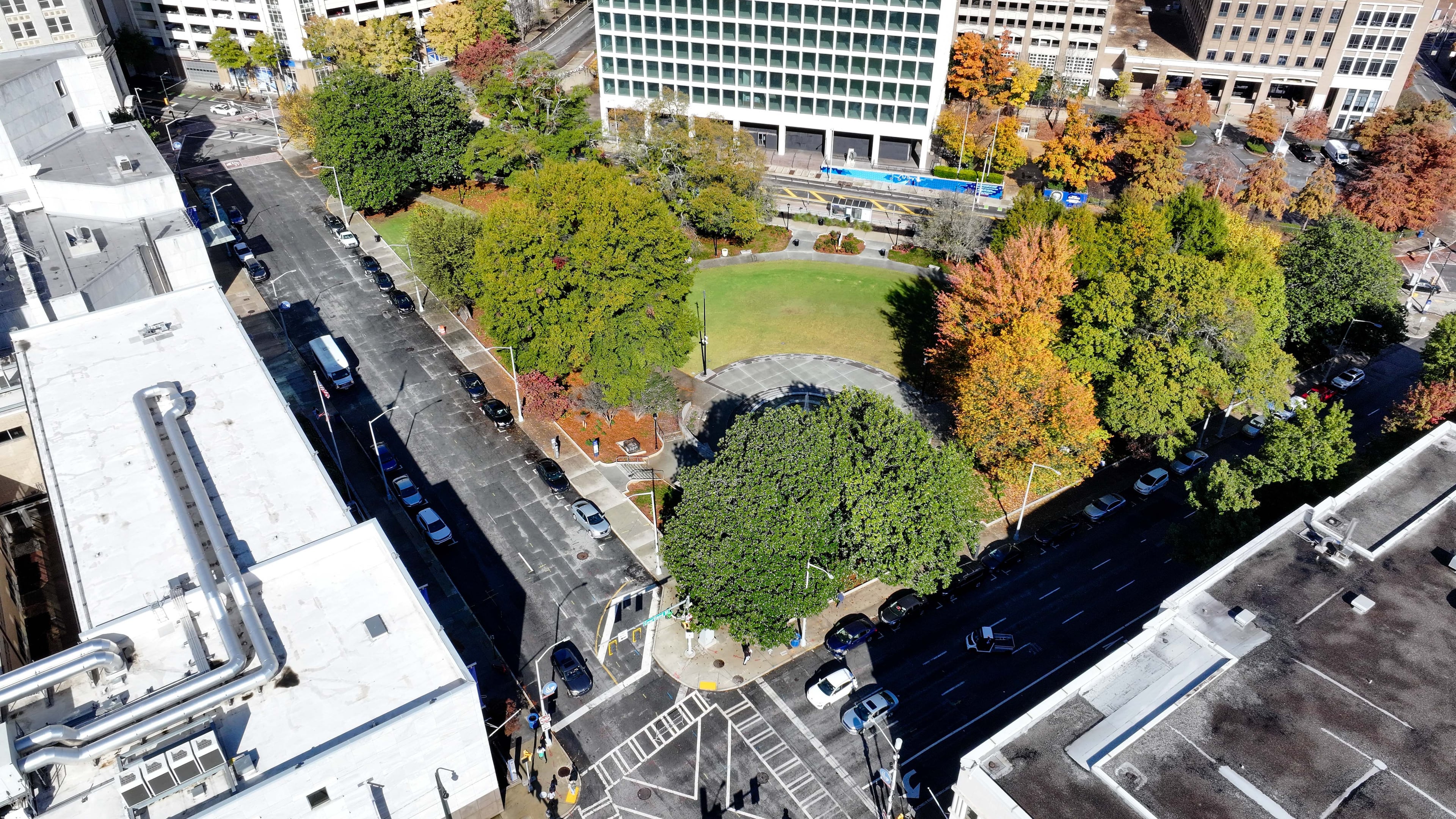NOW: This aerial image shows the Hurt Park, located by the University campus landscape triangle on Gilmer Street, on Wednesday, November 20, 2024. Leaders at Georgia State University plan to transform a section of Gilmer Street into a vibrant green space for students. The proposal involves expanding the “Panther Quad” by closing part of Gilmer Street to vehicles and creating a dedicated area for gathering and relaxation.
(Miguel Martinez / AJC)