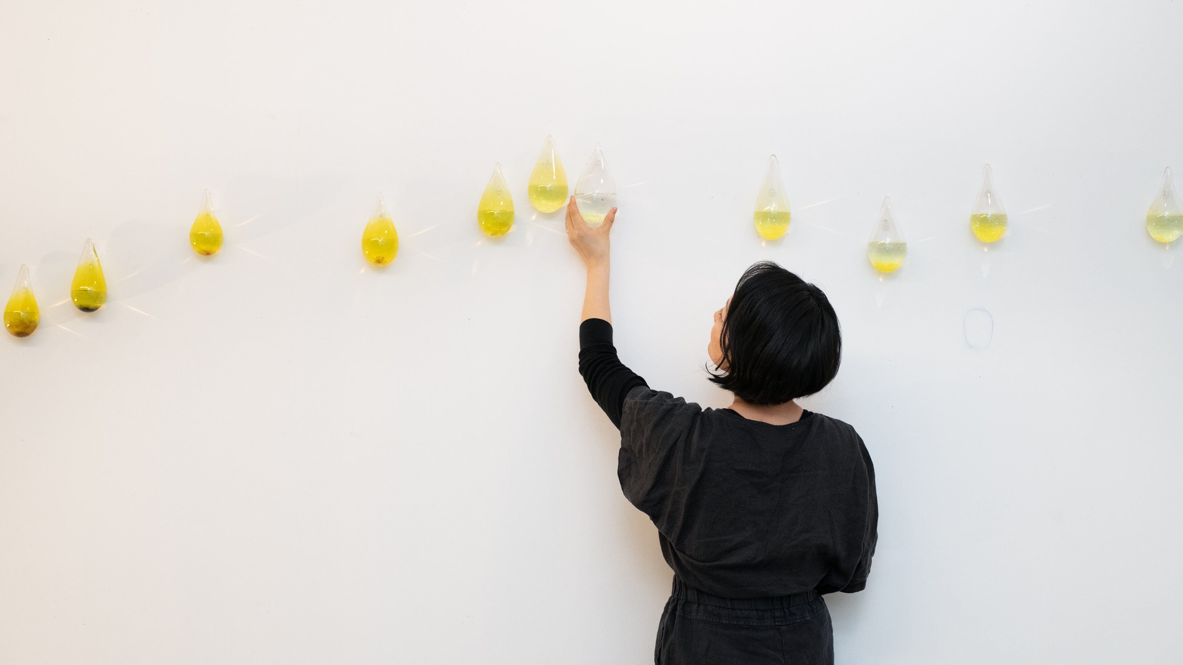 Gyun Hur with an installation of “Our mothers, our water, our peace” in her studio, 2024. The artist is attempting to create a platform for communal healing following the 2021 murder of six women of Asian descent by a white man at Atlanta area spas.