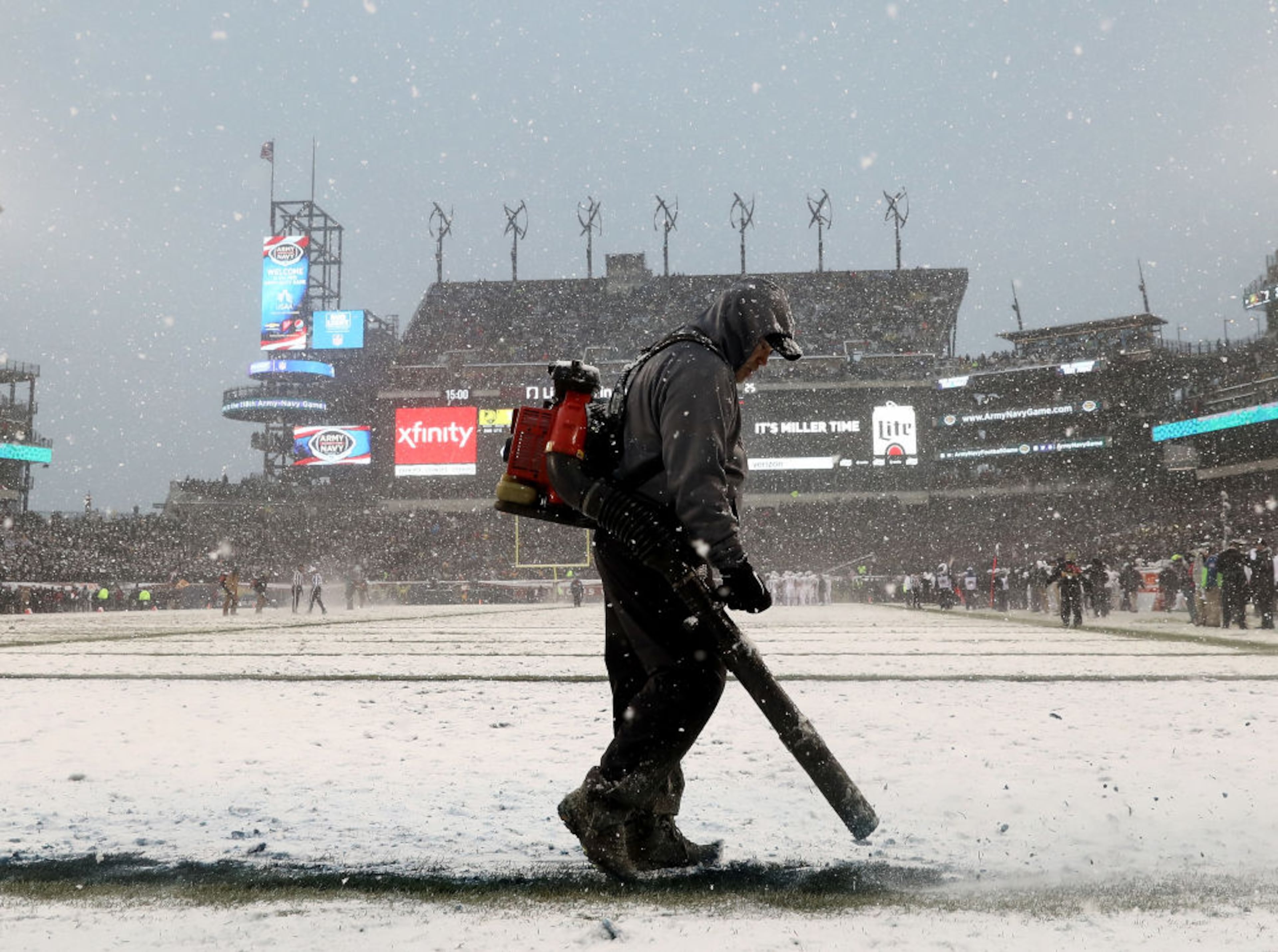 PHILADELPHIA, PA - DECEMBER 09: A member of the stadium crew clears the lin on the field during the first have of the game between the Army Black Knights and the Navy Midshipmen on December 9, 2017 at Lincoln Financial Field in Philadelphia, Pennsylvania. (Photo by Elsa/Getty Images)