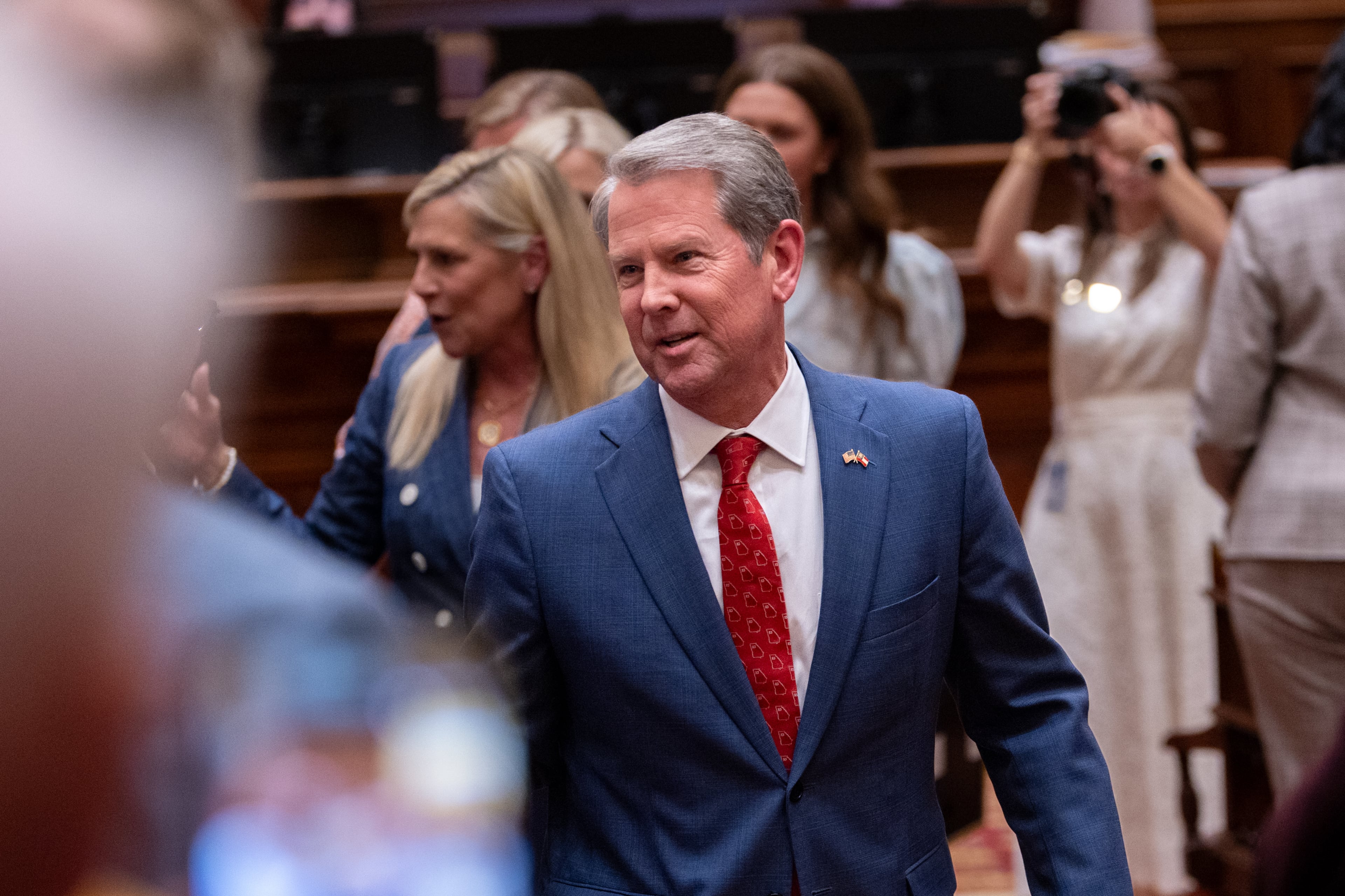 Gov. Brian Kemp greets state representatives before making his final speech at the House of Representatives on Sine Die, the last day of the legislative session, at the Capitol. (Arvin Temkar/AJC)