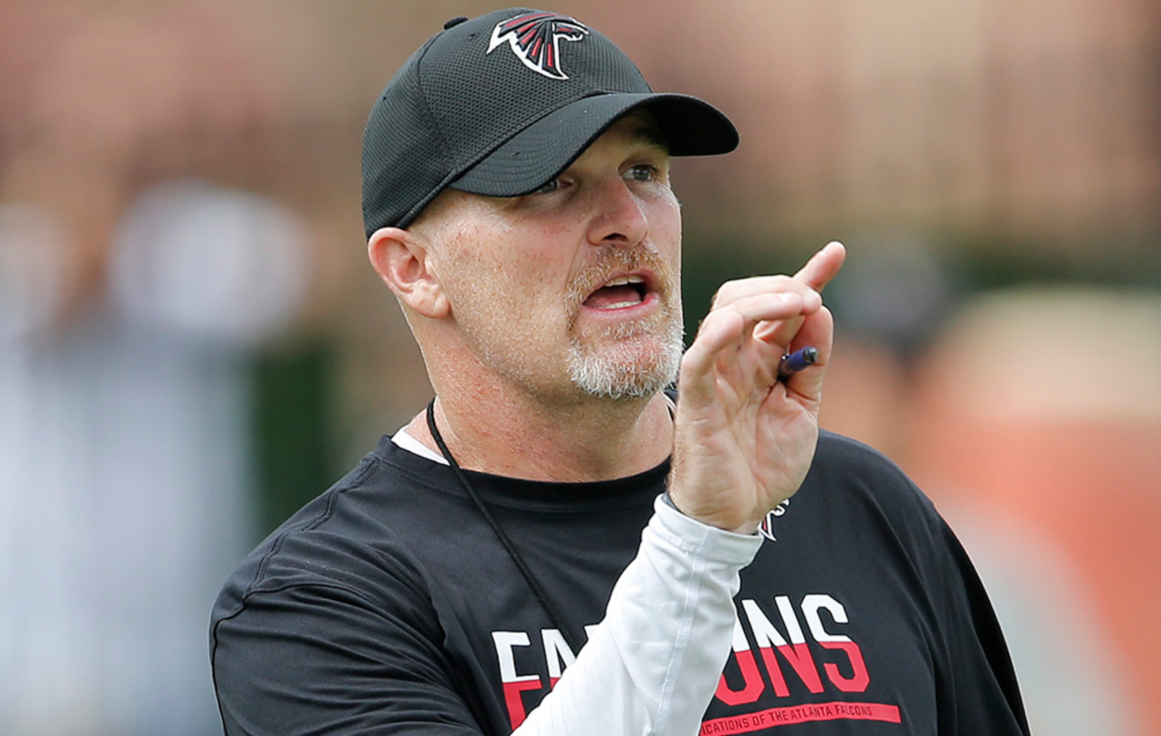 Atlanta Falcons head coach Dan Quinn talks to his players during practice Thursday, Aug. 4, 2016, in Flowery Branch, Ga.