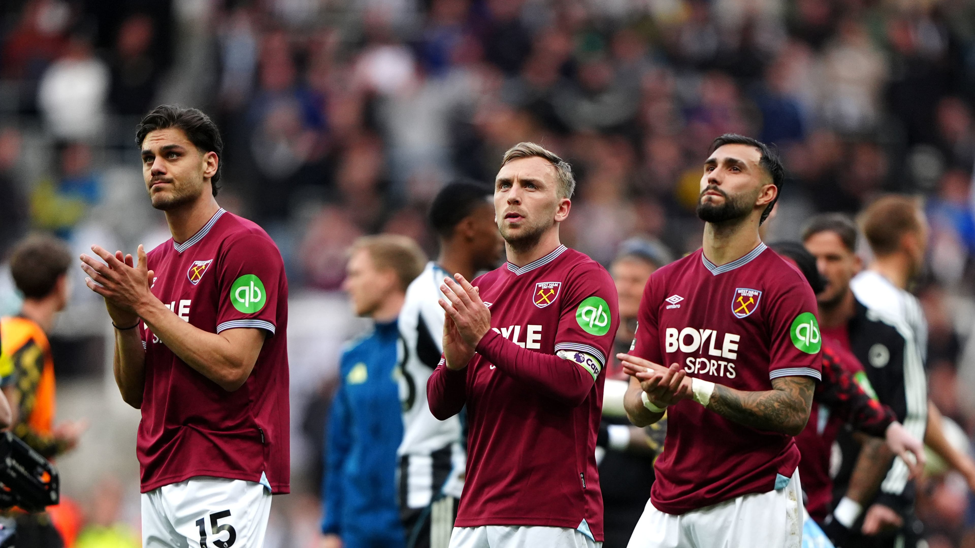 From left, West Ham United's Konstantinos Mavropanos, Jarrod Bowen and Valentin Castellanos applauds the fans following their English Premier League soccer match against Newcastle United in Newcastle upon Tyne, England, Sunday, May 17, 2026. (Owen Humphreys/PA via AP)