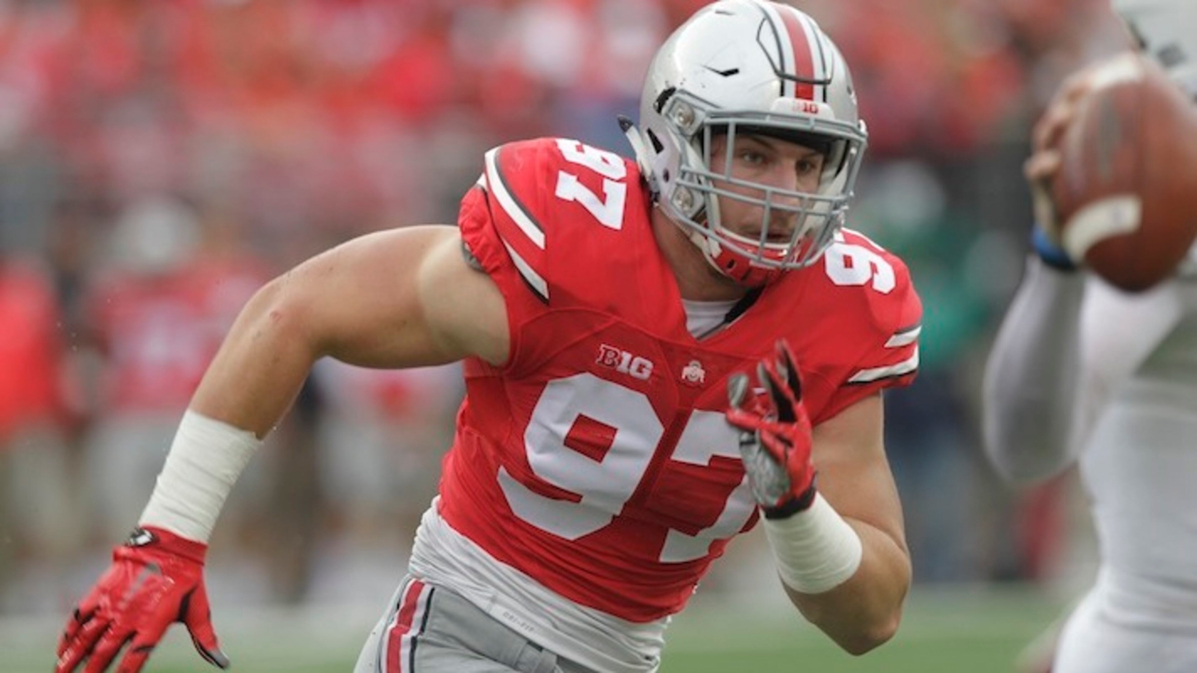 FILE - In this Sept. 19, 2015, file photo, Ohio State defensive lineman Joey Bosa plays plays against Northern Illinois during an NCAA college football game in Columbus, Ohio. Bosa is expected to be a first round pick at the NFL Draft.(AP Photo/Jay LaPrete, File)