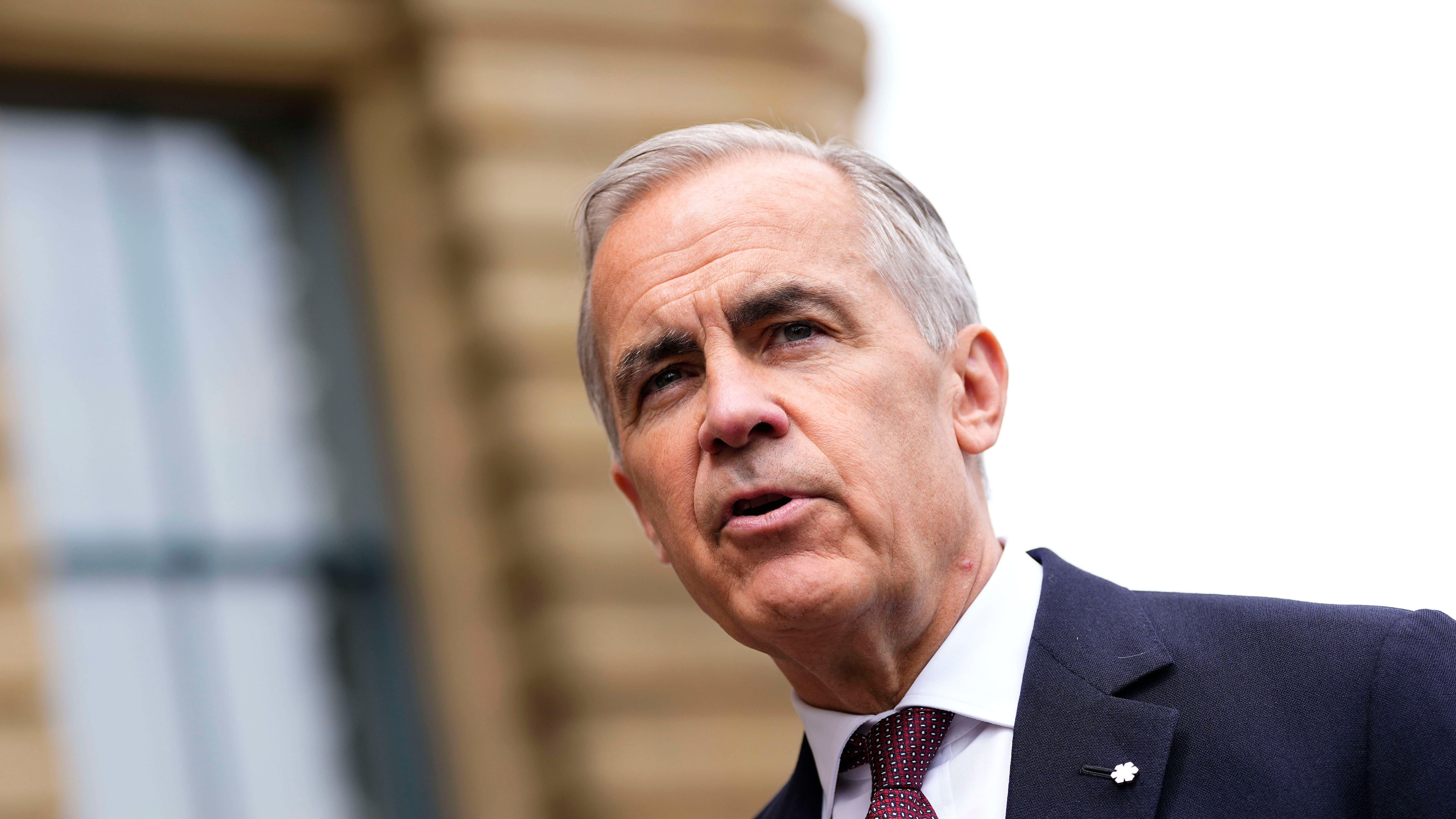 Prime Minister Mark Carney makes a statement outside the Office of the Prime Minister and Privy Council in Ottawa, on Tuesday, July 21, 2026. (Justin Tang/The Canadian Press via AP)