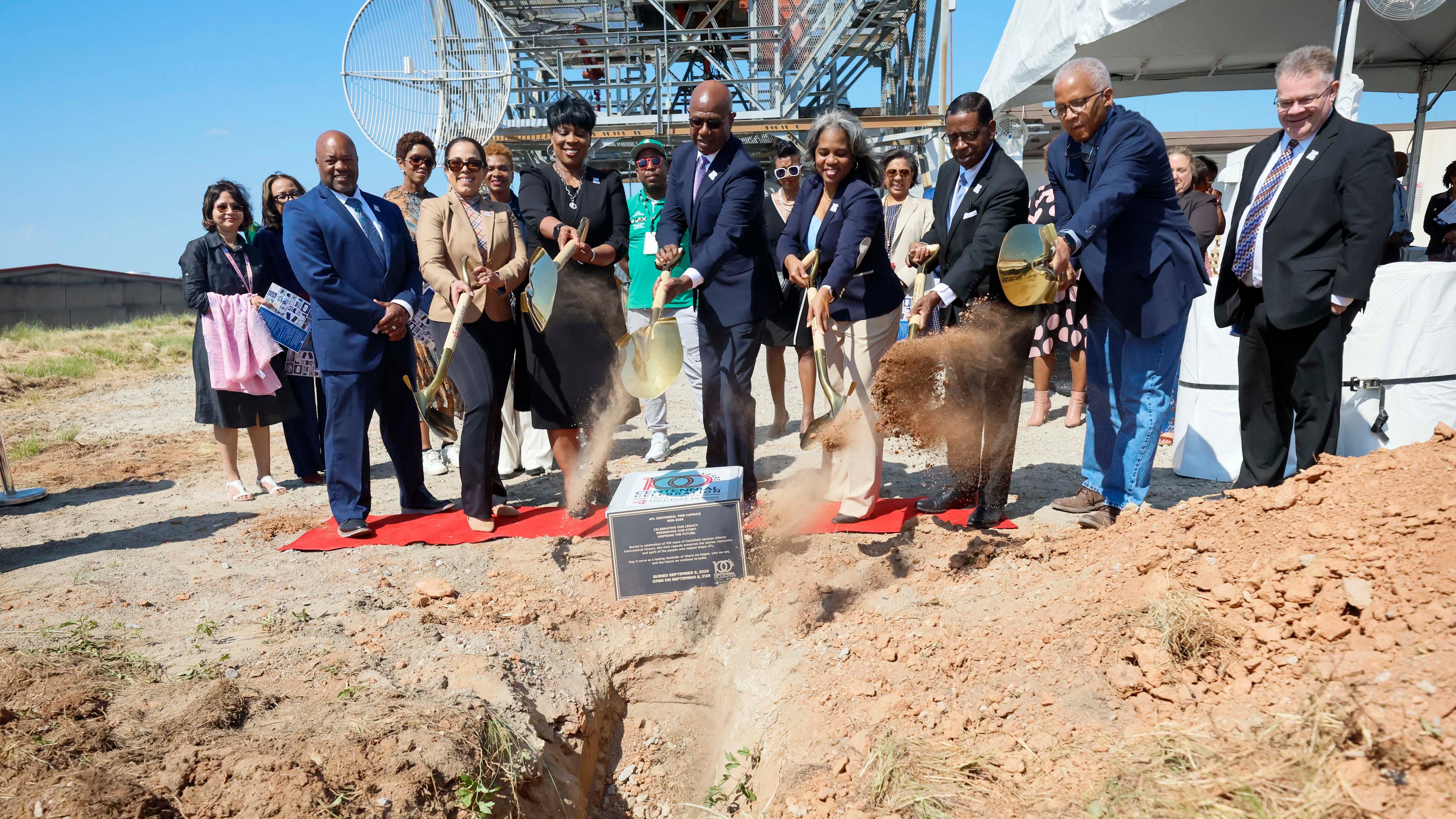 Airport and city leaders bury a time capsule on Stogner Hill at Hartsfield-Jackson Atlanta International Airport on Sep. 8, 2026. The event commemorates ATL’s 100th anniversary. (Miguel Martinez/AJC)