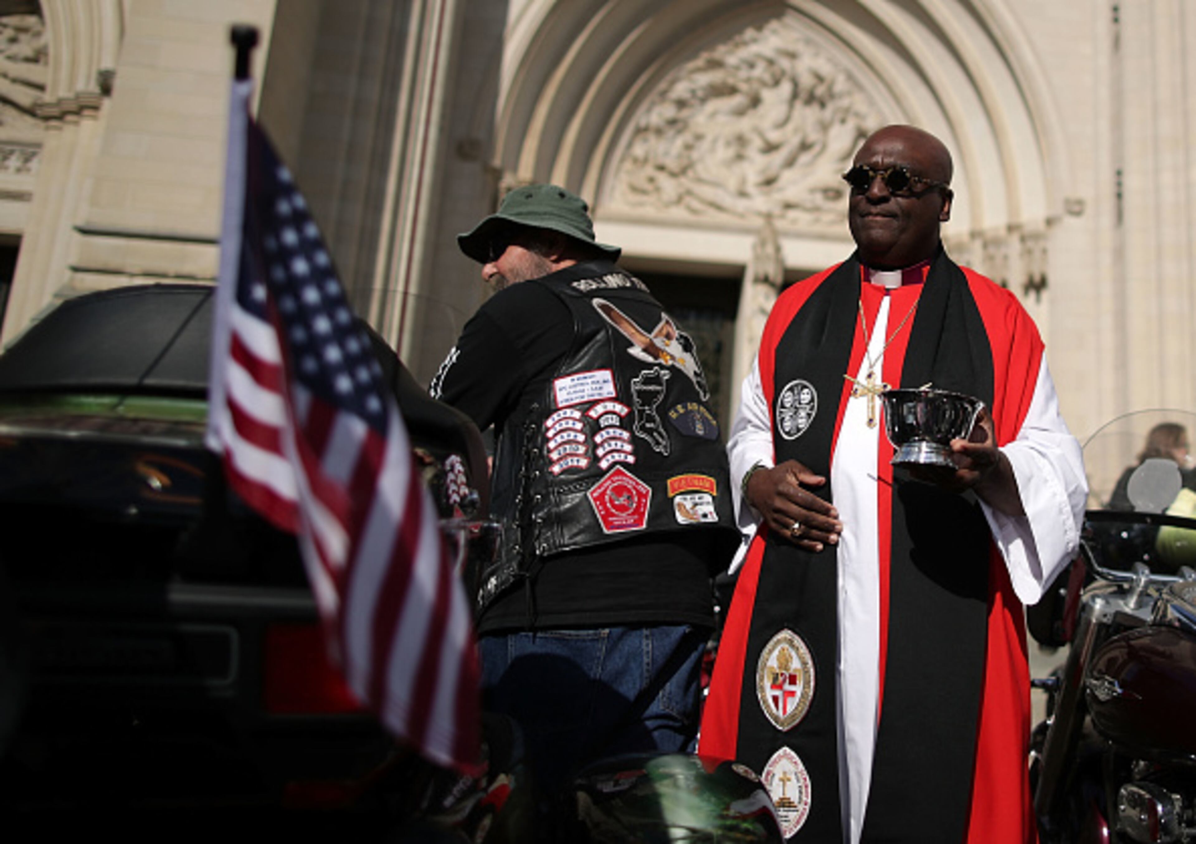 WASHINGTON, DC - MAY 26: The Rev. Carl Walter Wright, Bishop Suffragan for Armed Service and Federal Ministries, blesses bikes during a Blessing of the Bikes event at the National Cathedral May 26, 2017 in Washington, DC. Rolling Thunder will mark the 30th anniversary of its annual "Ride for Freedom" motorcycle procession and commemorative events this Memorial Day weekend for raising the attention of POW and MIA issues. (Photo by Alex Wong/Getty Images)