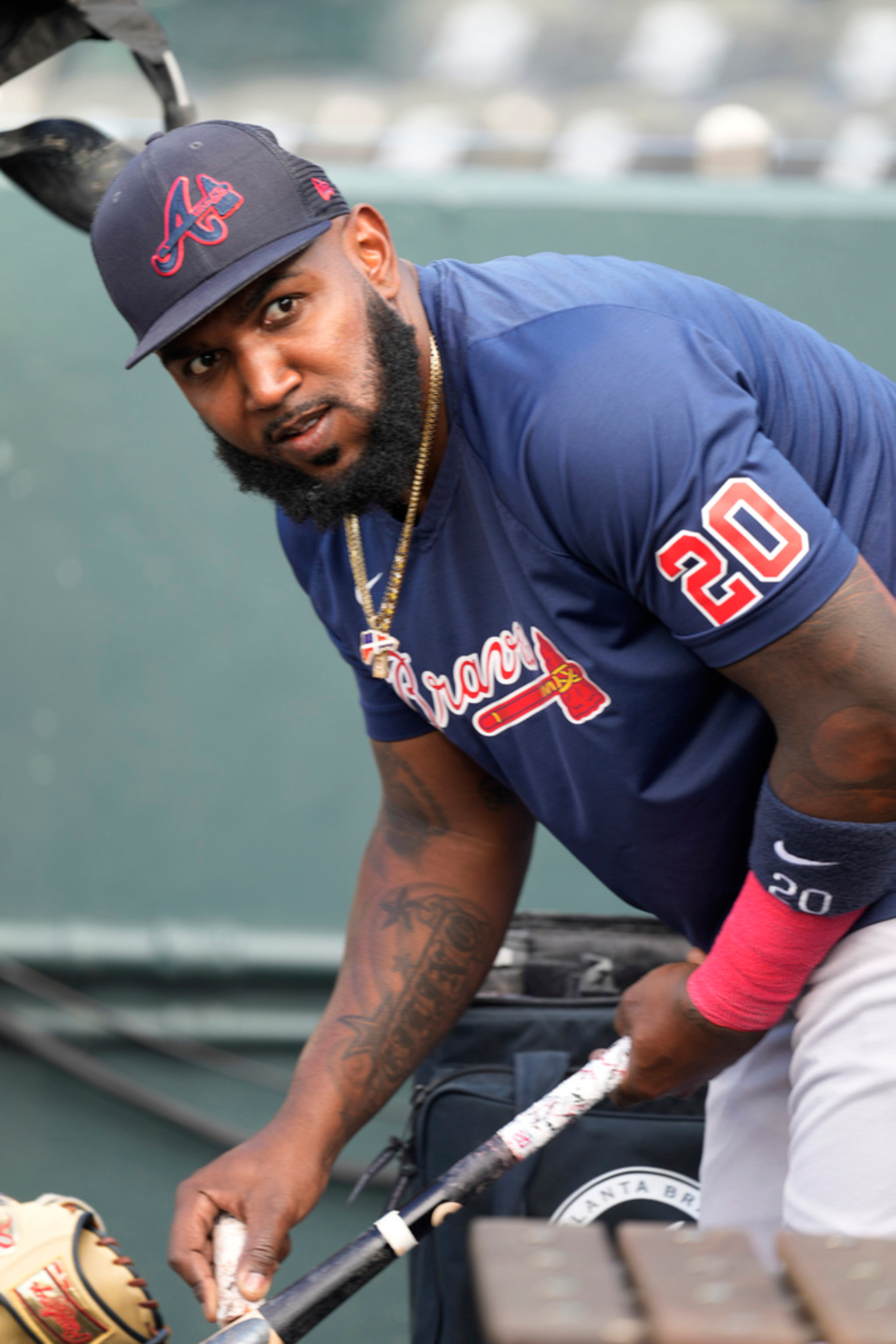 Atlanta Braves designated hitter Marcell Ozuna warms up for the team's baseball game against the Colorado Rockies on Wednesday, Aug. 30, 2023, in Denver. (AP Photo/David Zalubowski)