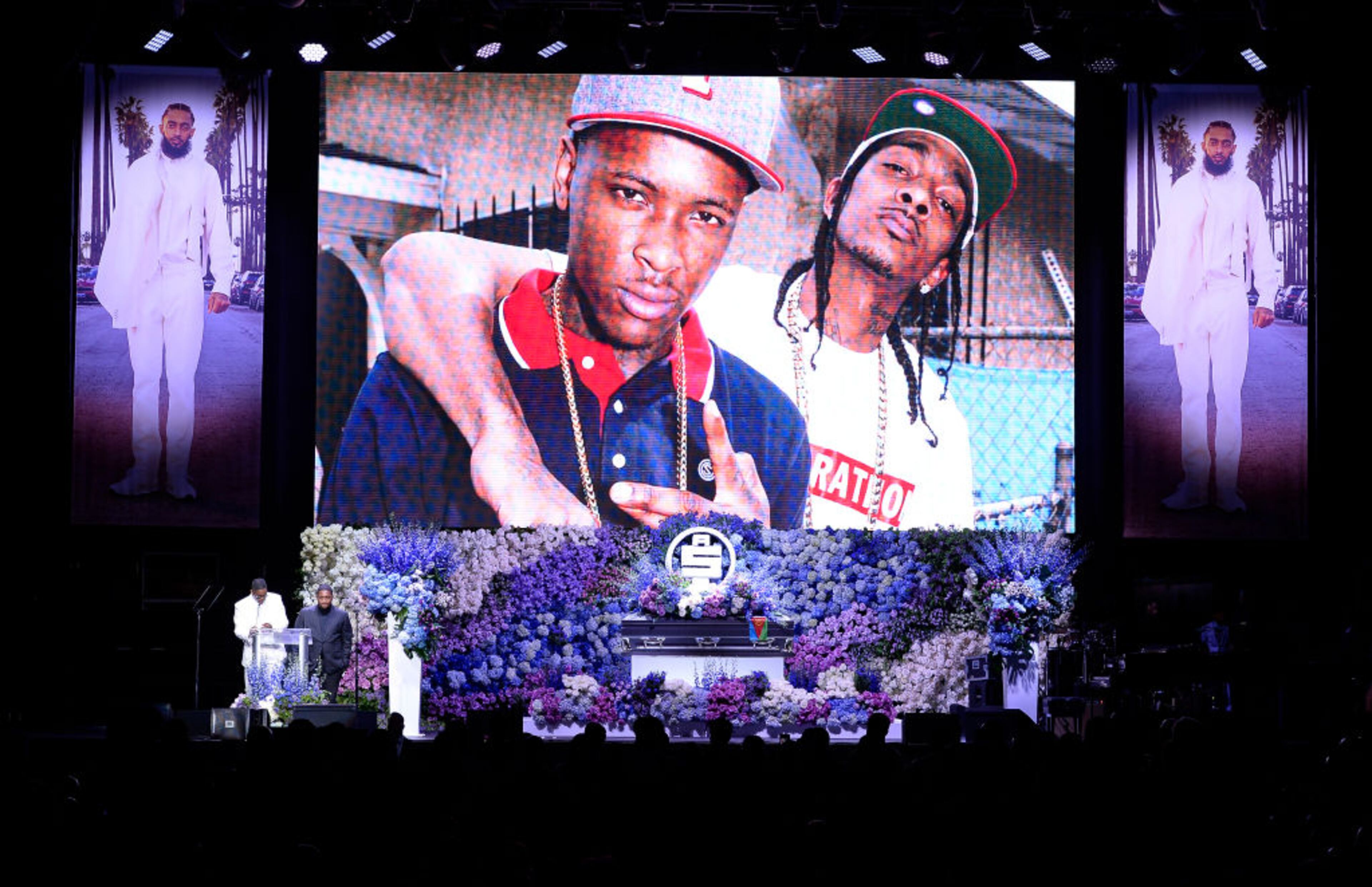 LOS ANGELES, CALIFORNIA - APRIL 11: (EDITORS NOTE: All images taken by Getty Images inside the Staples Center at Nipsey Hussle's Celebration of Life have been reviewed and approved for distribution by Atlantic Records) (L-R) YG and DJ Mustard speak onstage during Nipsey Hussle's Celebration of Life at STAPLES Center on April 11, 2019 in Los Angeles, California. Nipsey Hussle was shot and killed in front of his store, The Marathon Clothing, on March 31, 2019 in Los Angeles. (Photo by Kevork Djansezian/Getty Images For Atlantic Records)