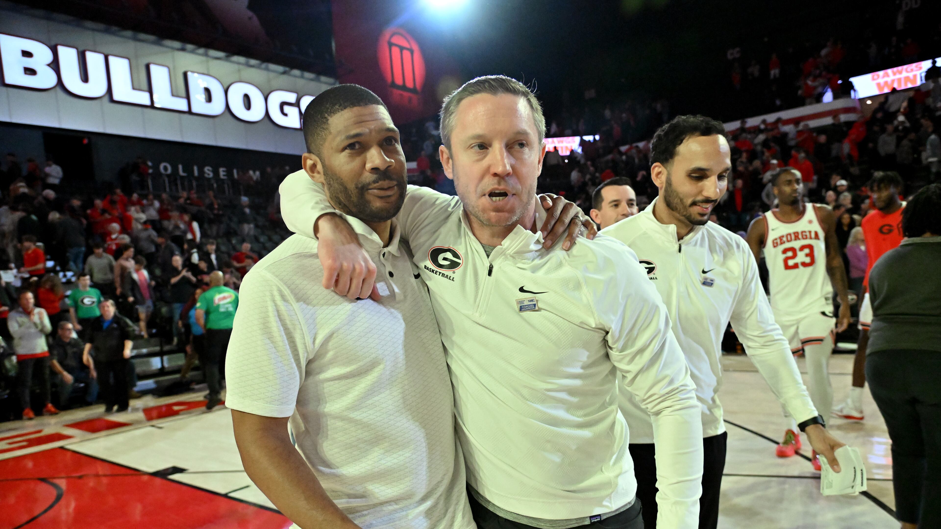 Georgia coach Mike White (right) celebrates with assistant coach Akeem Miskdeen after Georgia beat LSU during an NCAA college basketball game at Stegeman Coliseum, Wednesday, January 24, 2024, in Athens. Georgia won 68-66 over LSU. (Hyosub Shin / Hyosub.Shin@ajc.com)