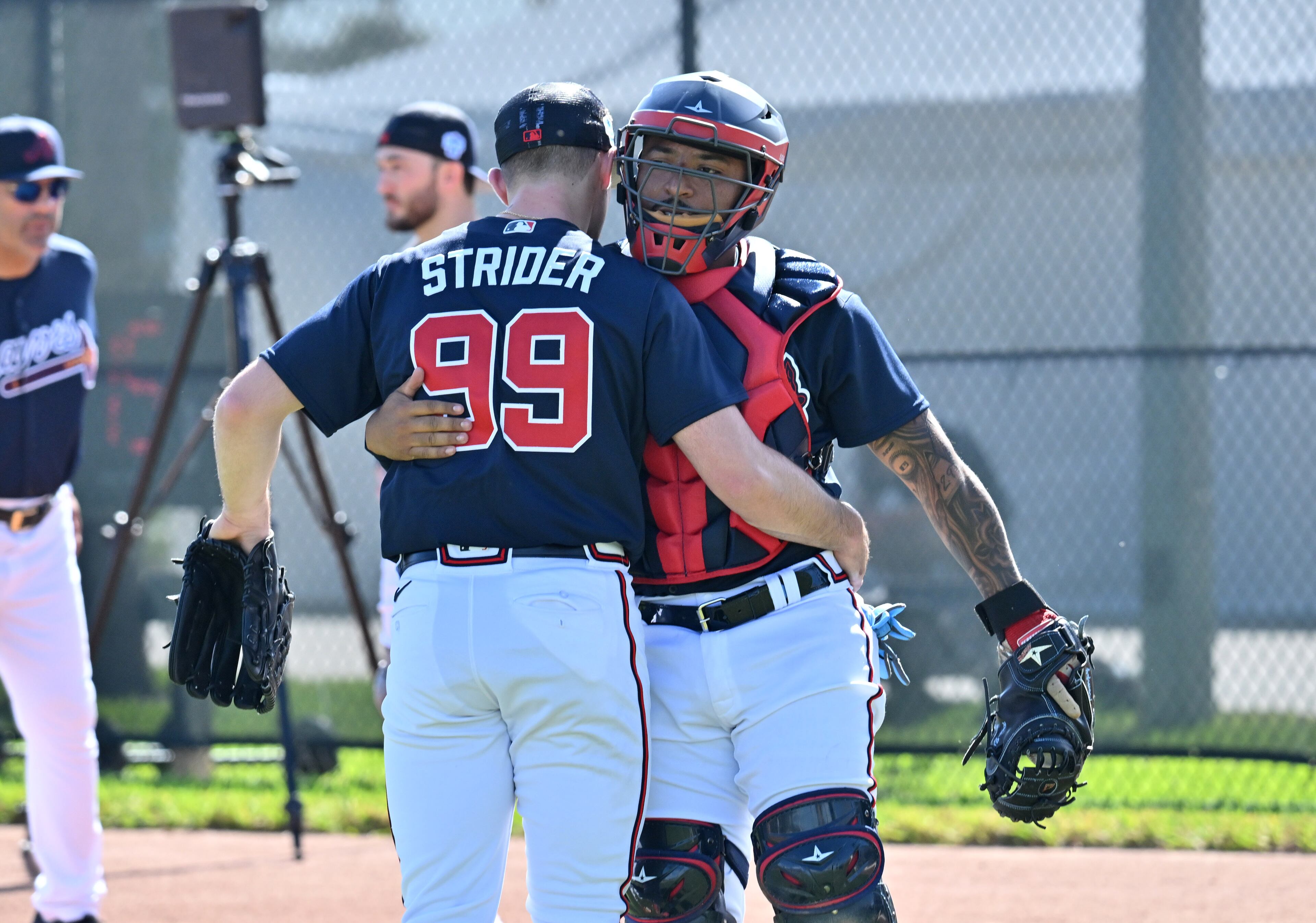 Braves starting pitcher Spencer Strider (left) and catcher Chadwick Tromp greet each other during spring training Thursday at CoolToday Park in North Port, Florida. (Hyosub Shin / Hyosub.Shin@ajc.com)