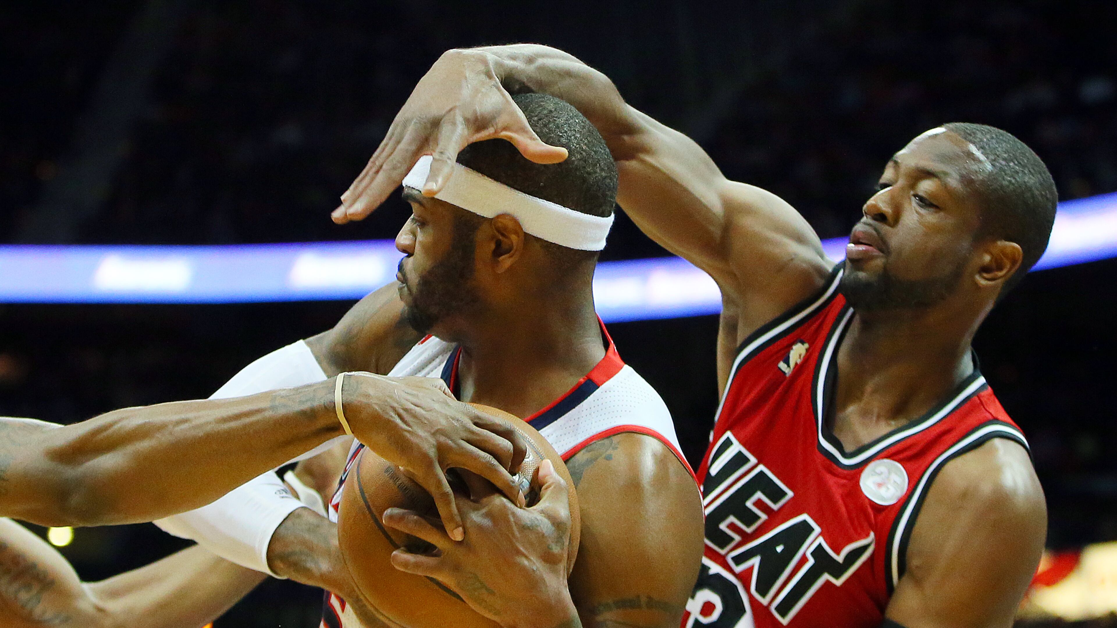 022013 ATLANTA: Miami Heat Dwyane Wade helps double team Atlanta Hawks Josh Smith during the first half of a NBA game on Wednesday, Feb. 20, 2013, in Atlanta. CURTIS COMPTON / CCOMPTON@AJC.COM