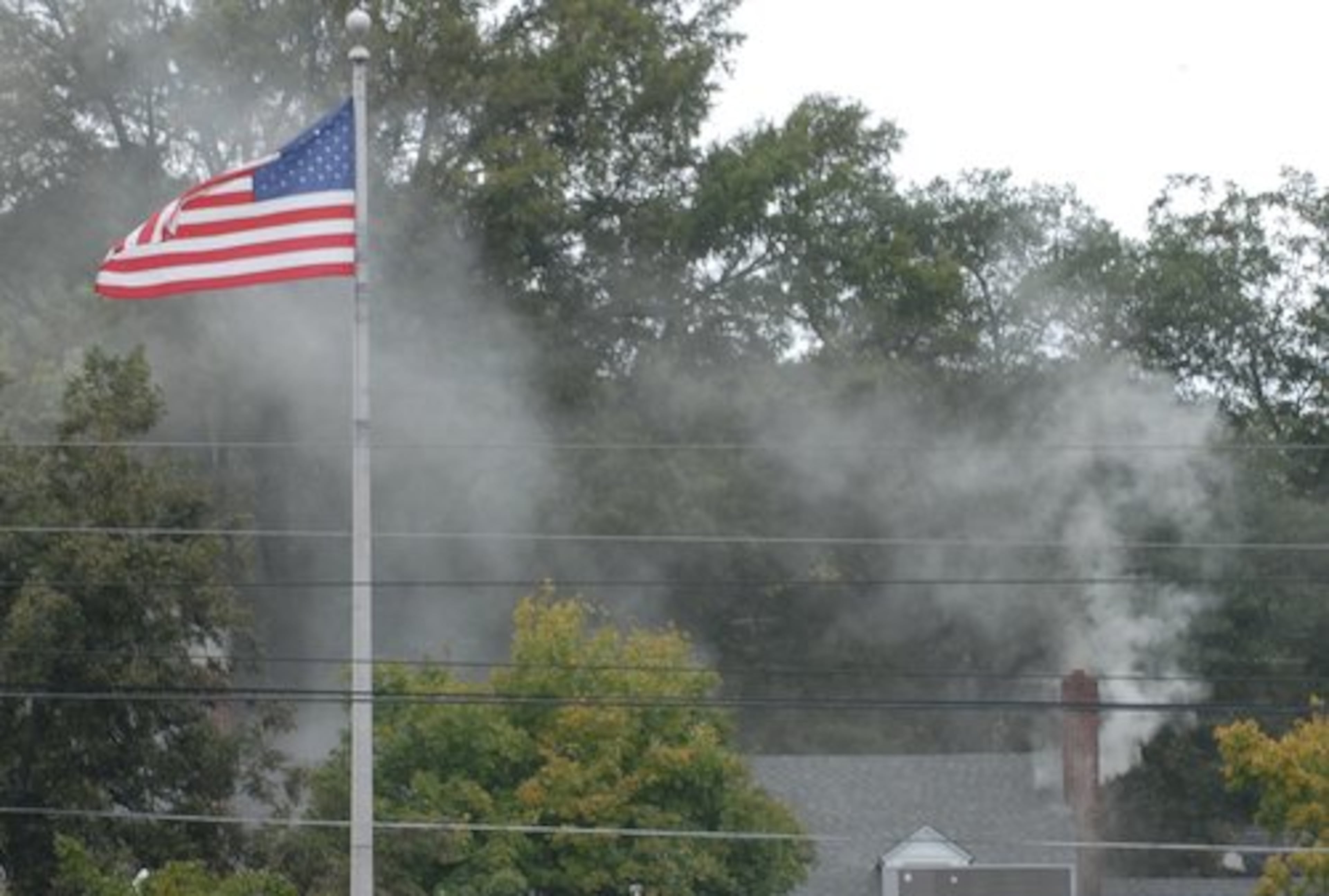 Smoke billows from the law offices of McCamy, Phillips, Tuggle & Fordham in Dalton after an explosion ripped the building on Friday morning. Georgia investigators say a 78-year-old man suspected of setting off the explosion has died.