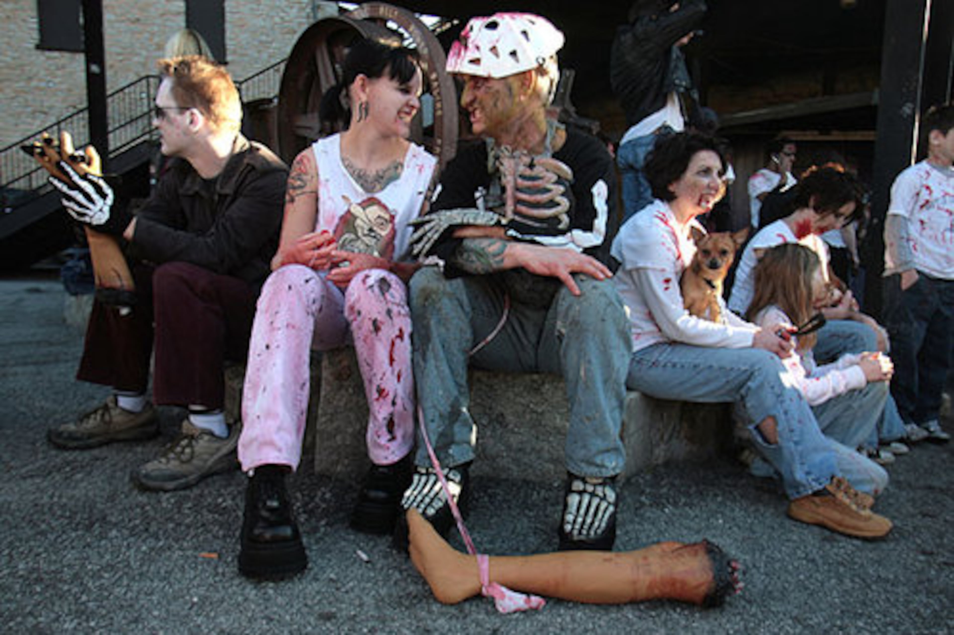 Niki Phillips (left) of Tallahassee, Fla., and Jason Freeman of Atlanta snarl at each other as they wait outside the Masquerade for the Zombie Wallk.