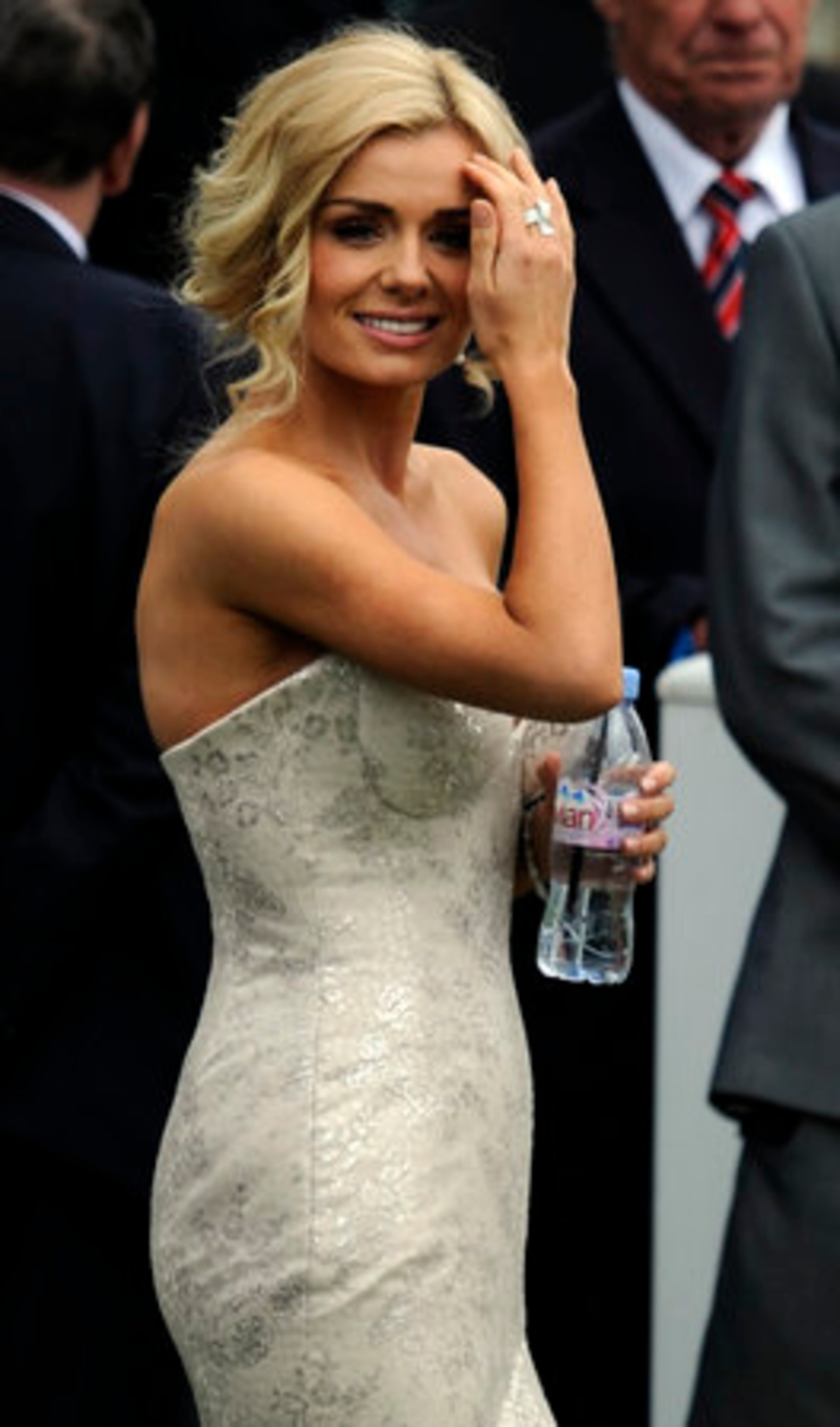 Katherine Jenkins makes her way onto the course to sing the national anthem as Britain's Queen Elizabeth II arrives for the Epsom Derby at Epsom race course, southern England at the start of a four-day Diamond Jubilee celebration.