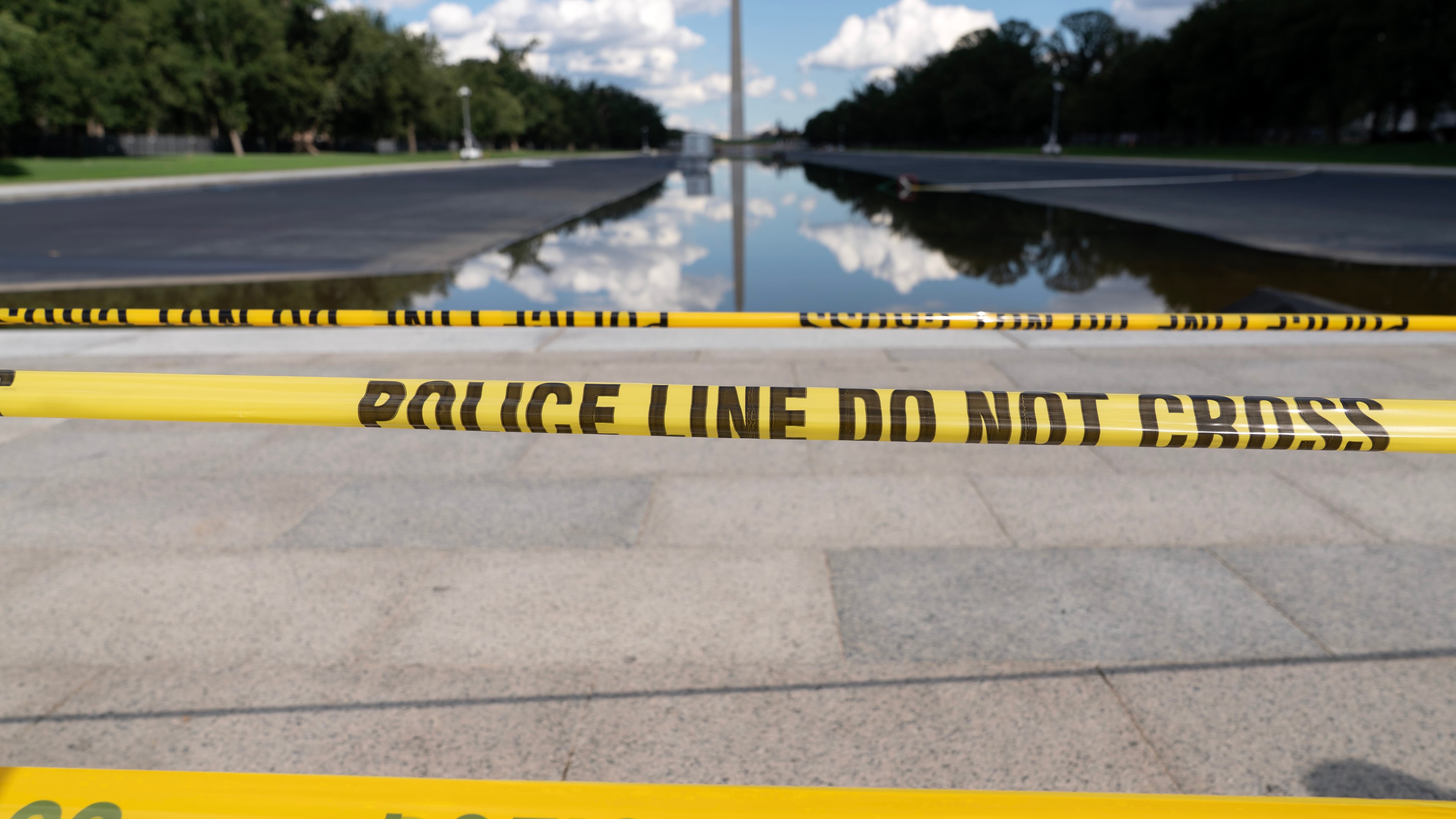 FILE - The Lincoln Memorial Reflecting Pool is seen with police line yellow tape at the National Mall, Sept. 6, 2026, in Washington. (AP Photo/Jose Luis Magana, File)