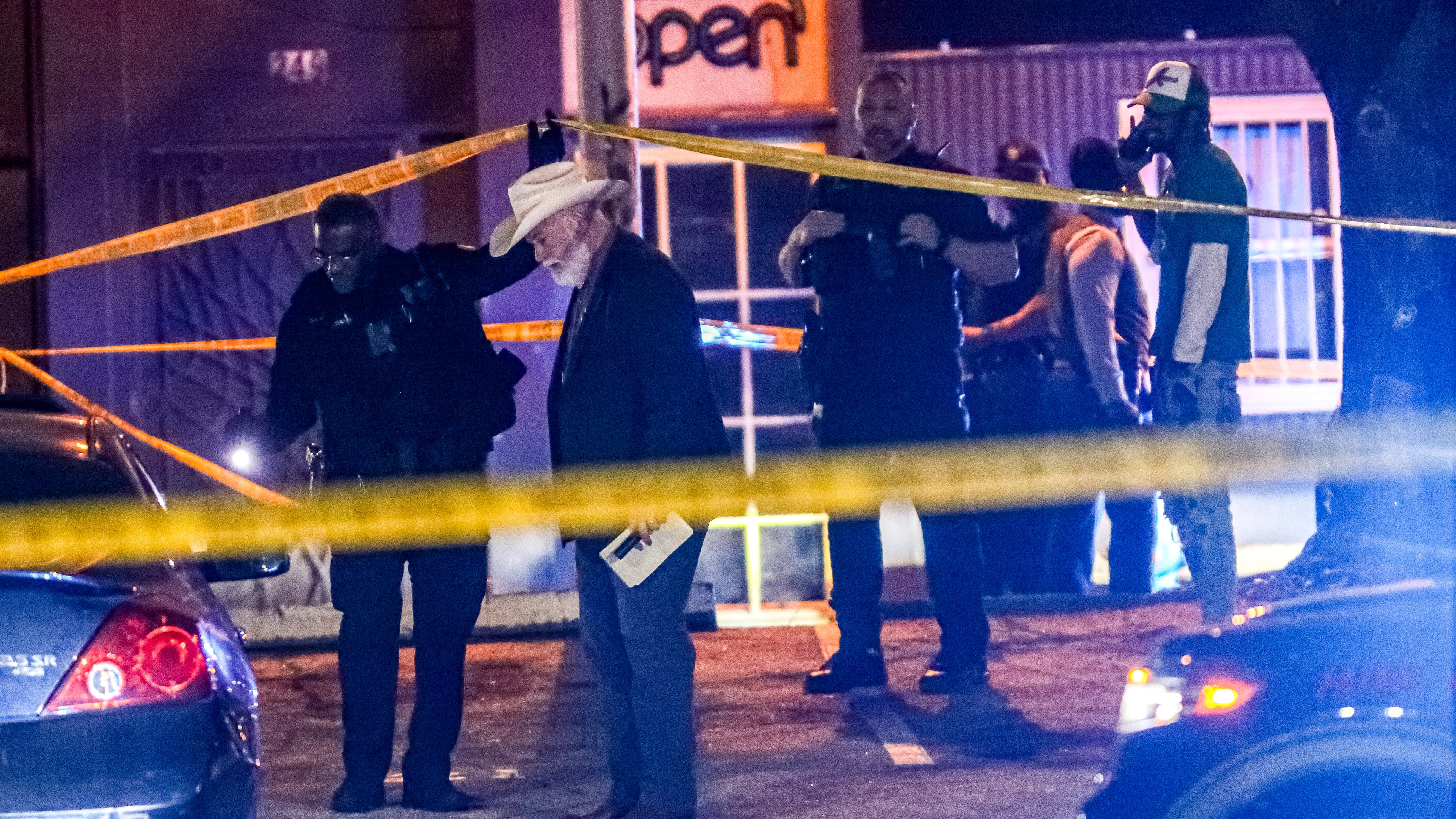 Authorities investigate a fatal shooting in the 250 block of Trinity Avenue on March 22. John Spink / John.Spink@ajc.com