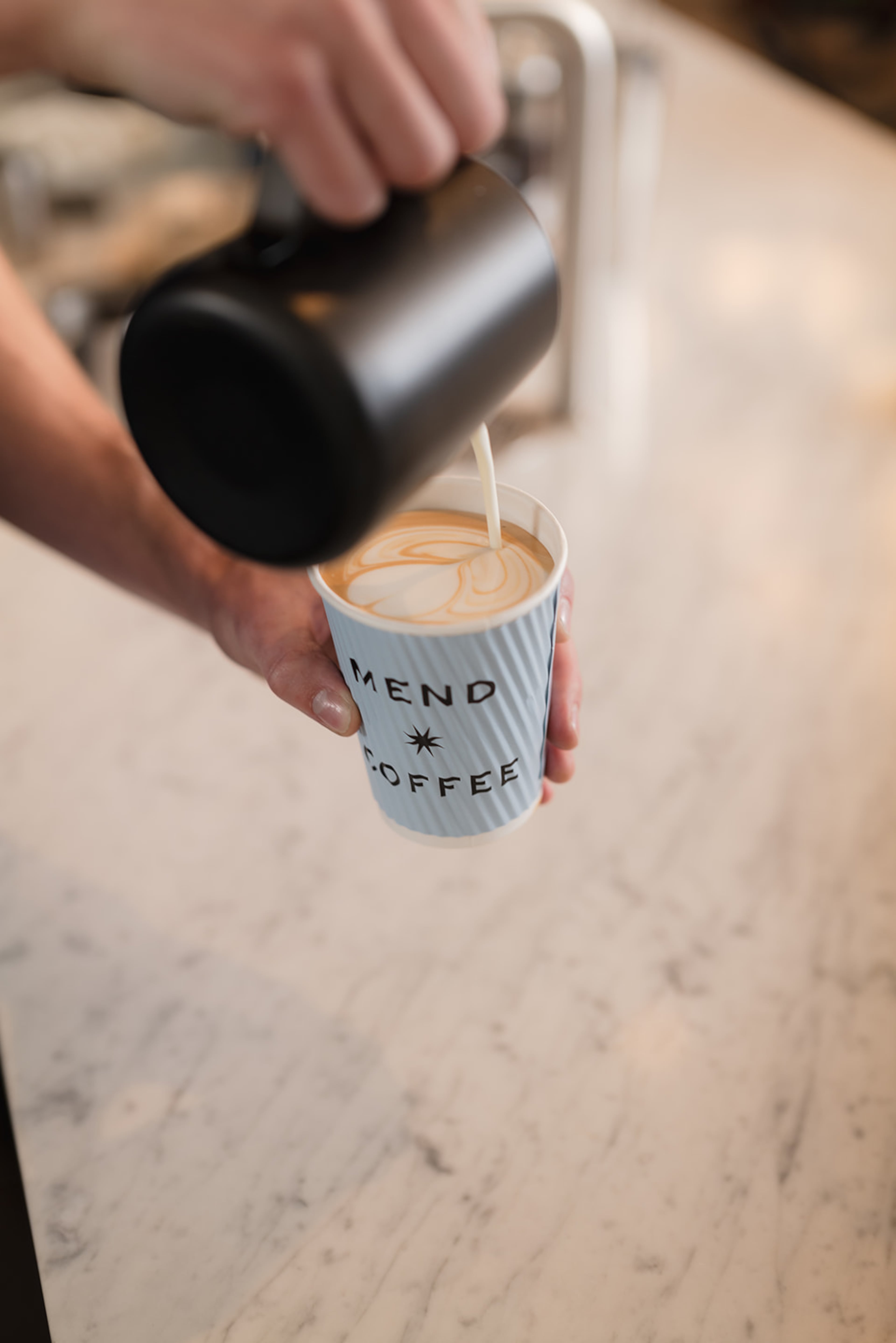 Mend Coffee & Goods offers a variety of coffee drinks using beans roasted by locally-based Bellwood Coffee. / Courtesy of Bryan Johnson Studio