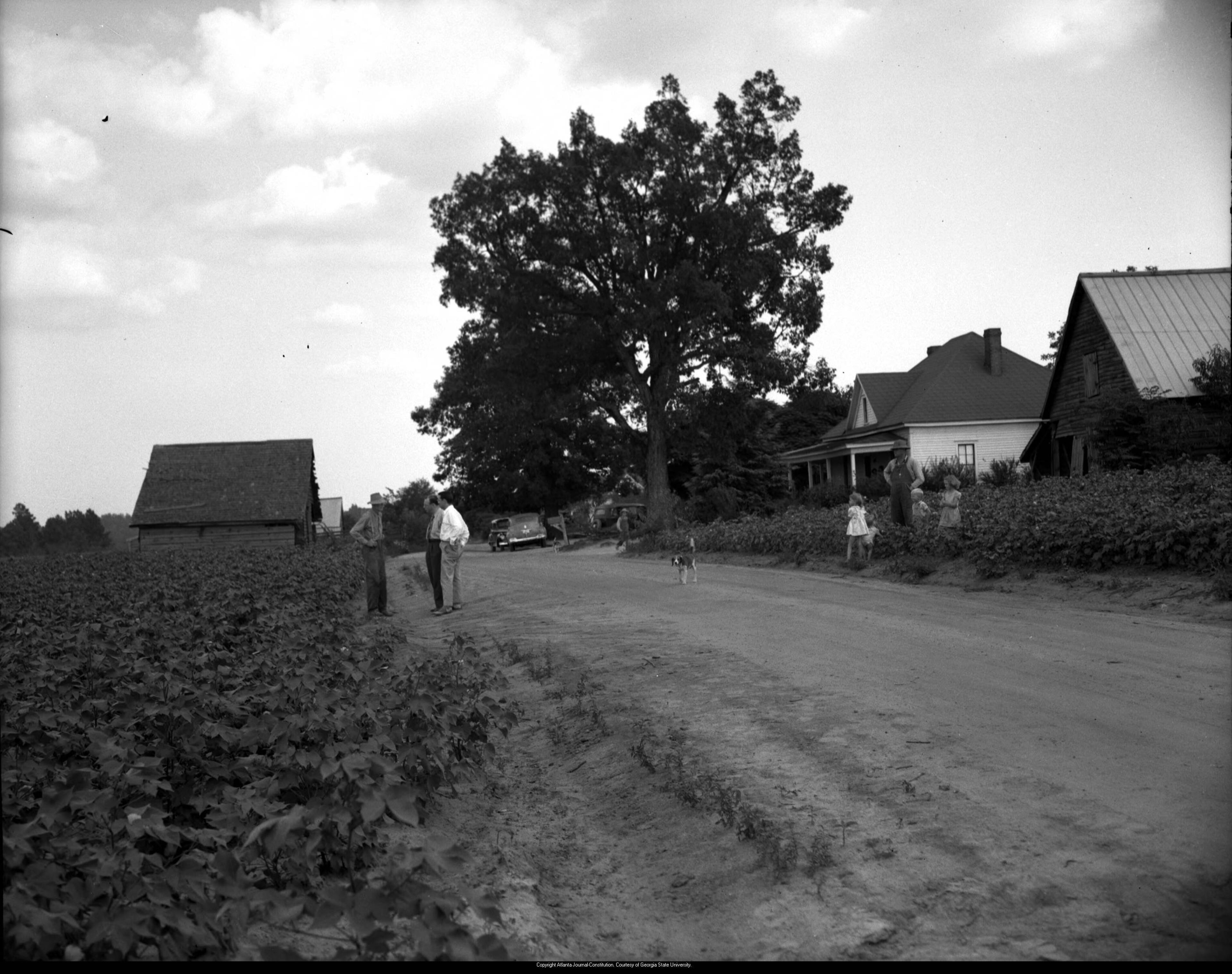 July 1946 -- Two FBI or Georgia Bureau of Investigation agents question a Walton County farmer in relation to the lynching.