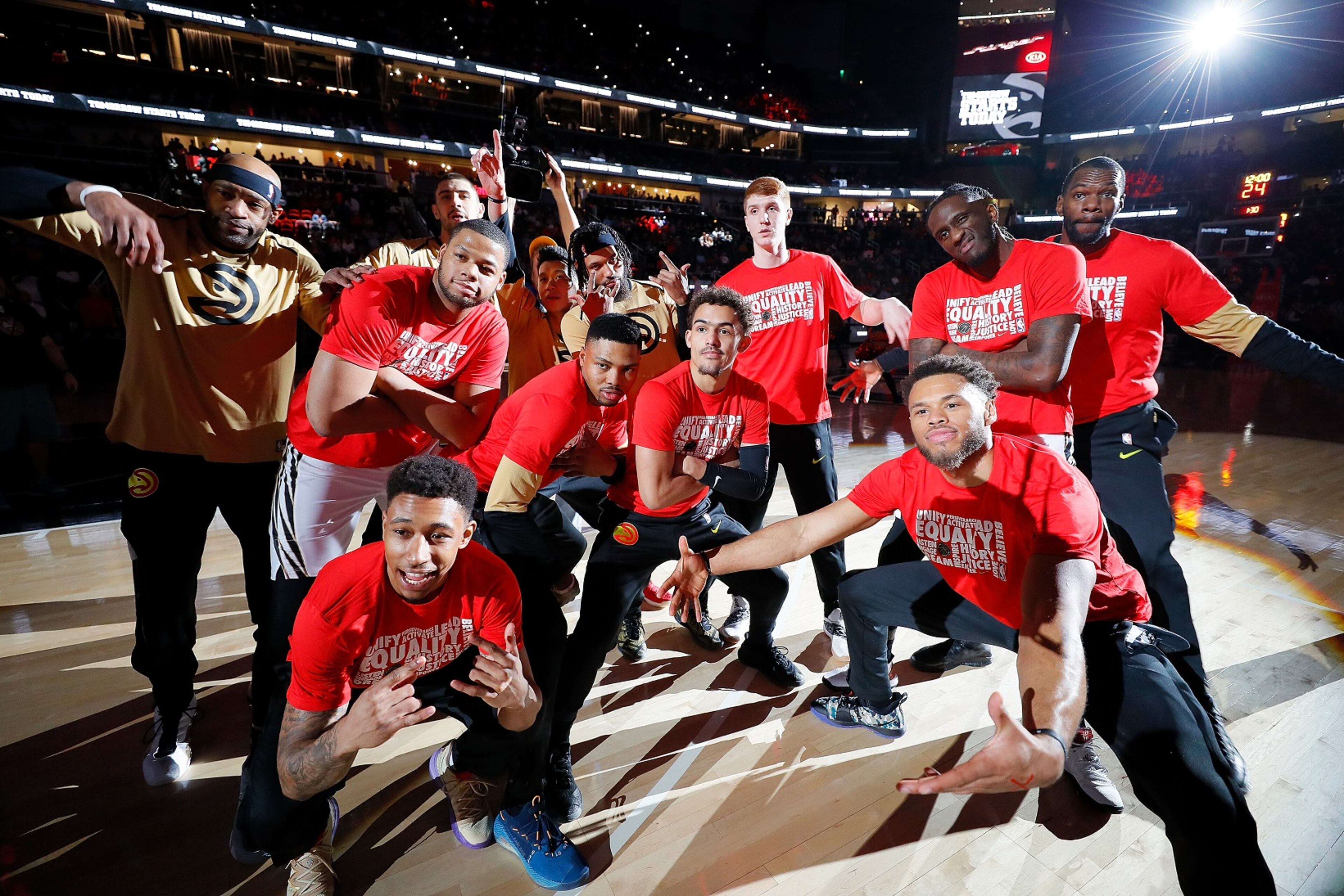 Hawks players pose for a photo after introductions prior to facing the Toronto Raptors at State Farm Arena. (Photo by Kevin C. Cox/Getty Images)