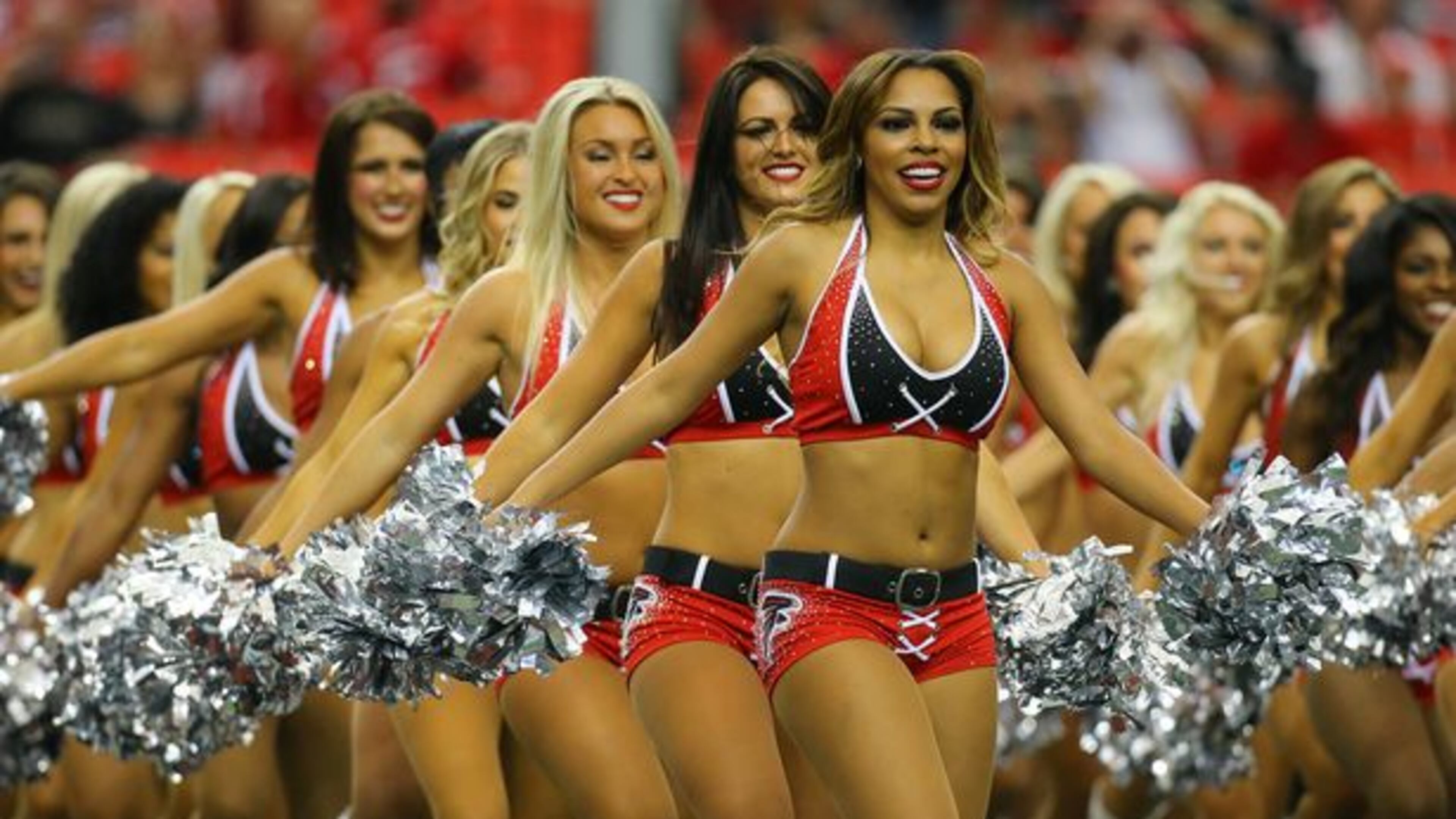 The Falcons cheerleaders take the field to perform in their NFL football game against the Saints on Sunday, Sept. 7, 2014, in Atlanta. (Curtis Compton)