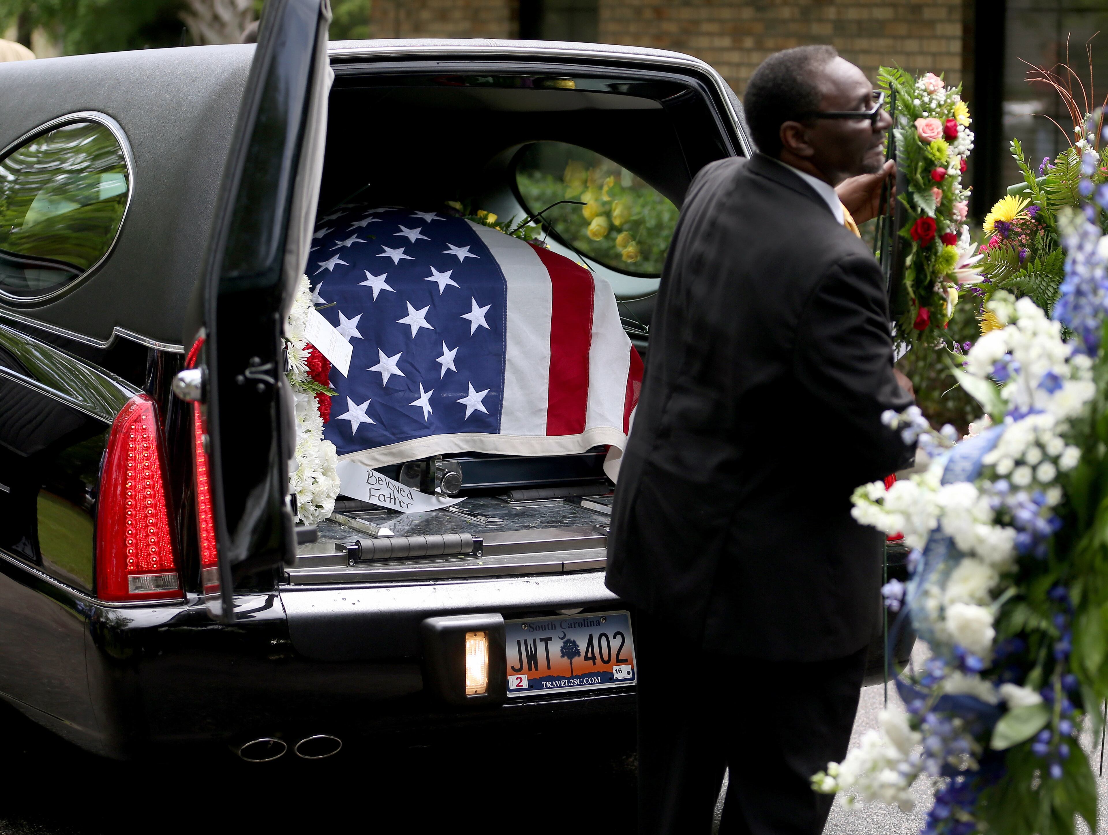 SUMMERVILLE, SC - APRIL 11: The casket of Walter Scott sits in the hearse after a funeral service at the W.O.R.D. Ministries Christian Center, after he was fatally shot by a North Charleston police officer after fleeing a traffic stop in North Charleston on April 11, 2015 in Summerville, South Carolina. Mr. Scott was killed on April 4 by North Charleston police officer Michael T. Slager after a traffic stop. The officer now faces murder charges. (Photo by Joe Raedle/Getty Images)