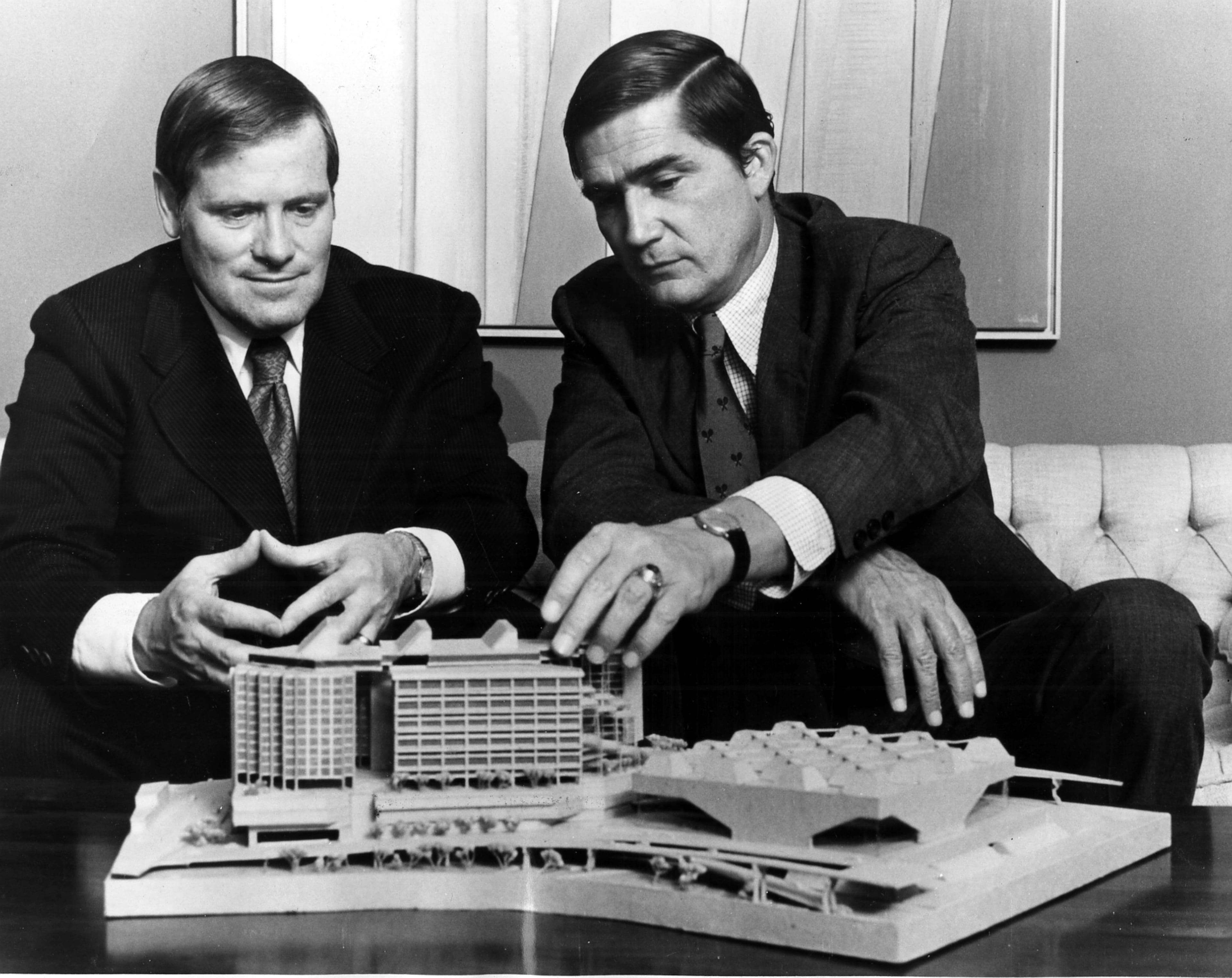 Maurice D. Alpert and Thomas G. Cousins look over plans for the Omni Coliseum in 1972. The waffle-roofed Omni was Atlanta's premier indoor sports pavilion. It was imploded and replaced by what is now known as State Farm Arena. (Courtesy)