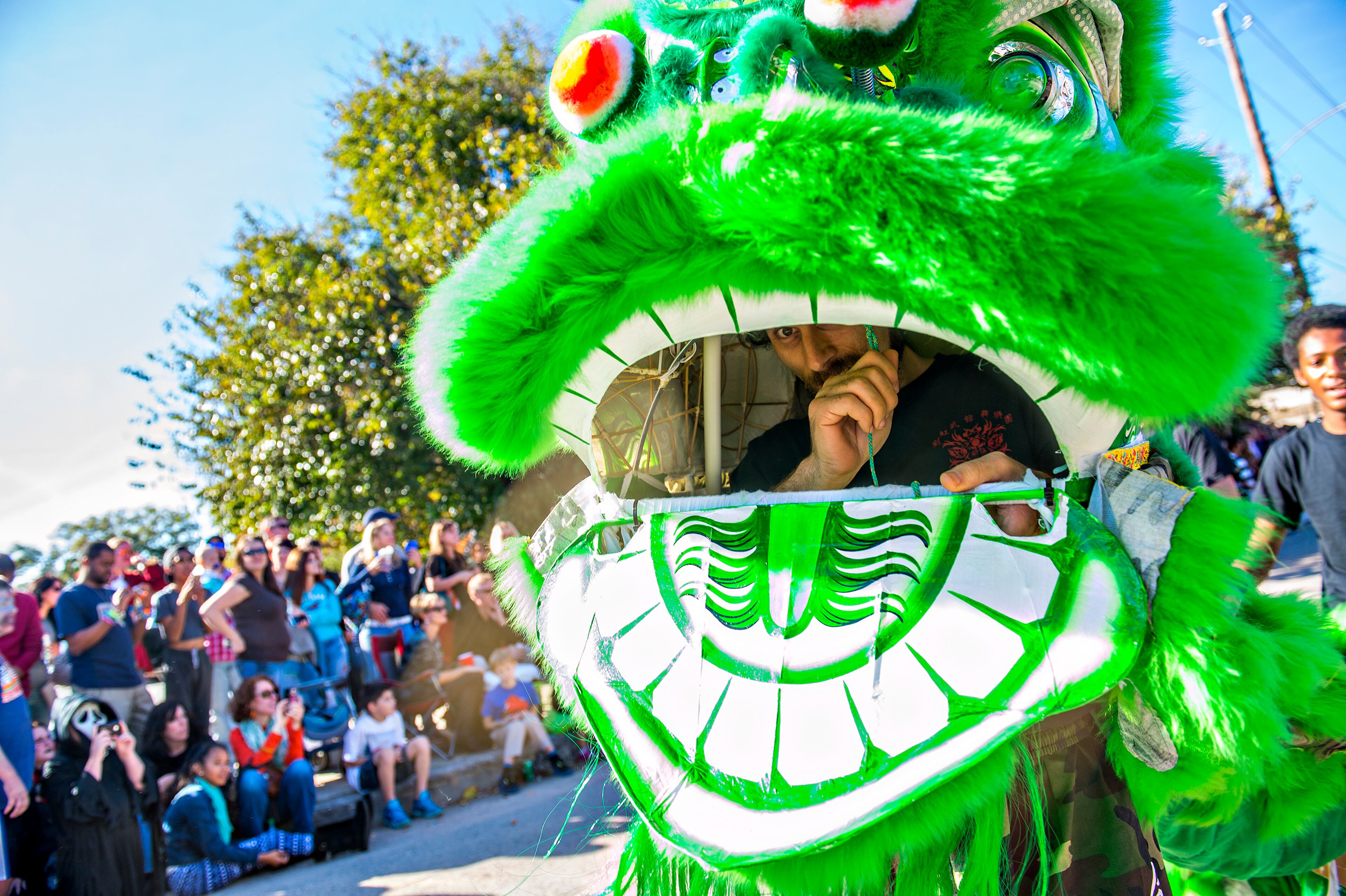 October 17, 2015 Atlanta - Andrew Zucker works the head of a Chinese dragon during the Little Five Points Halloween Parade in Atlanta on Saturday, October 17, 2015. The annual parade brought out tens of thousands of people to watch the antics. JONATHAN PHILLIPS / SPECIAL
