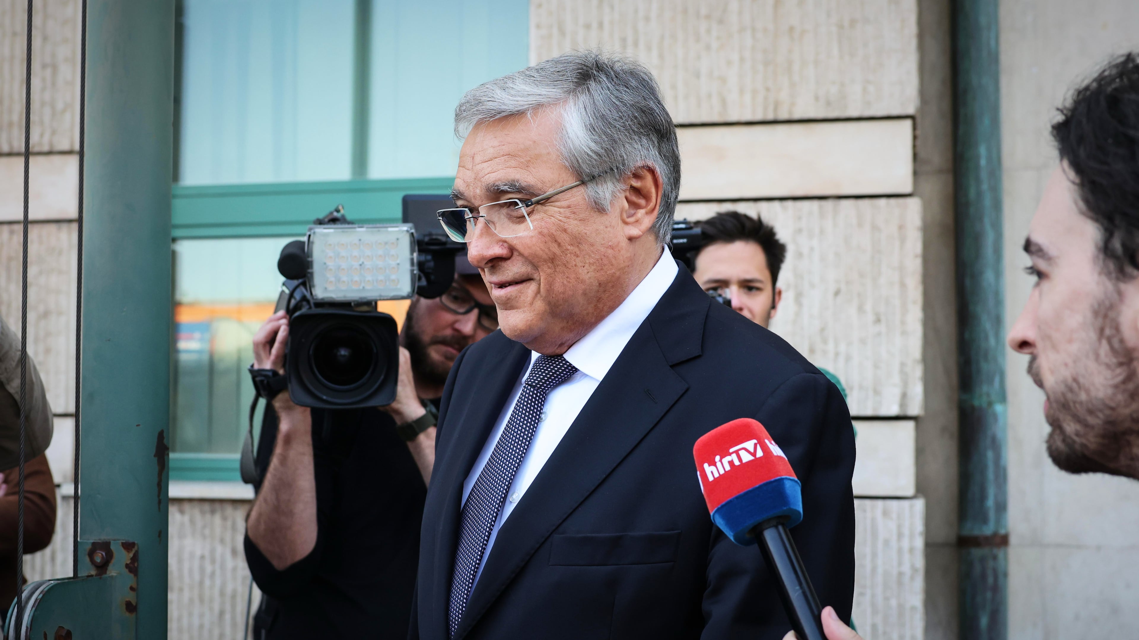 FILE - Russia's ambassador to Hungary, Evgeny Stanislavov, is surrounded by media as he leaves the Hungarian Foreign Ministry building, in Budapest, Thursday, May 14, 2026. (AP Photo, File)