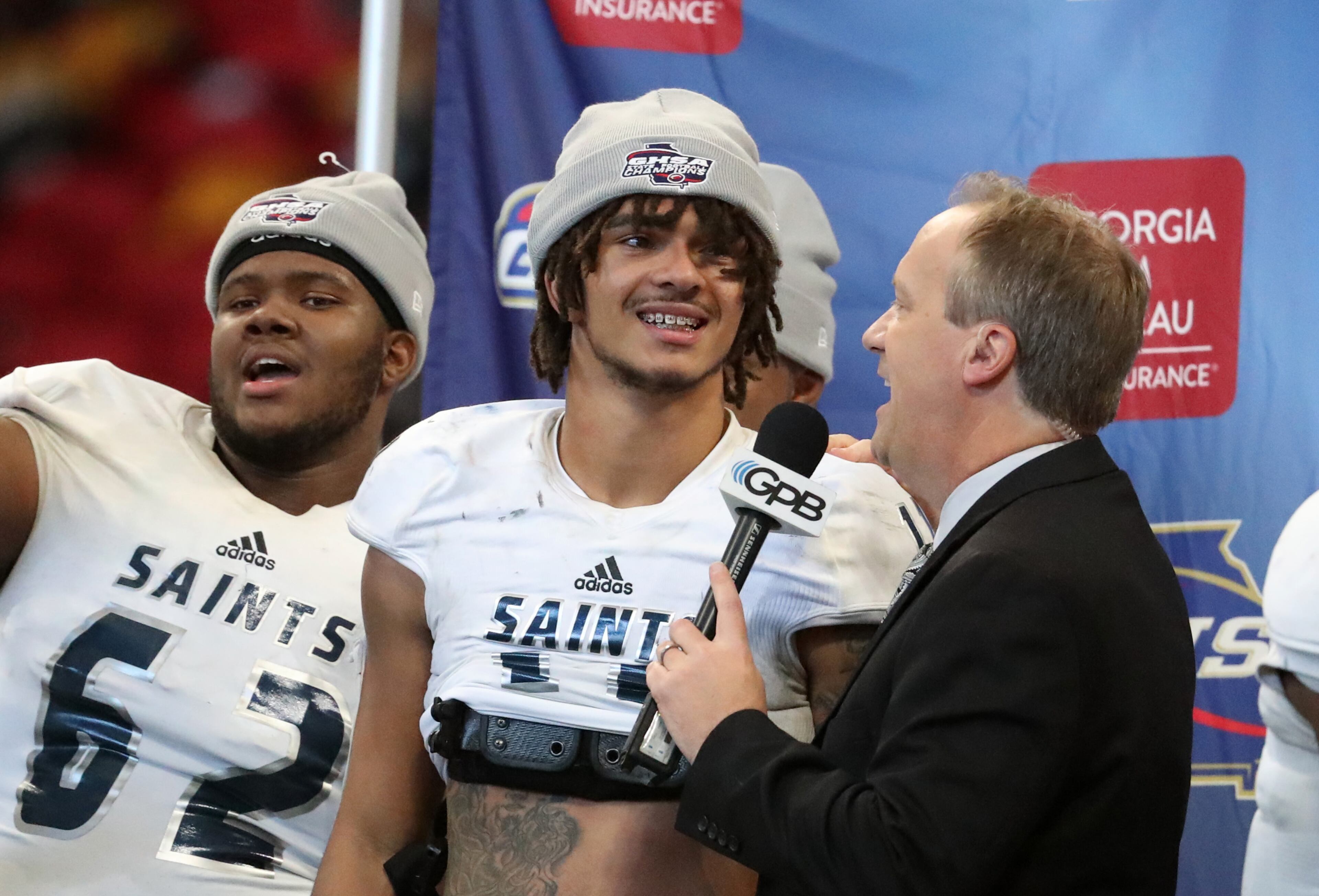 December 11, 2018 - Atlanta, Ga: Cedar Grove wide receiver Jadon Haselwood, center, celebrates after their 14-13 win against Peach County in the Class AAA State Championship at Mercedes-Benz Stadium, Tuesday, December 11, 2018, in Atlanta. (Jason Getz/Special to the AJC)