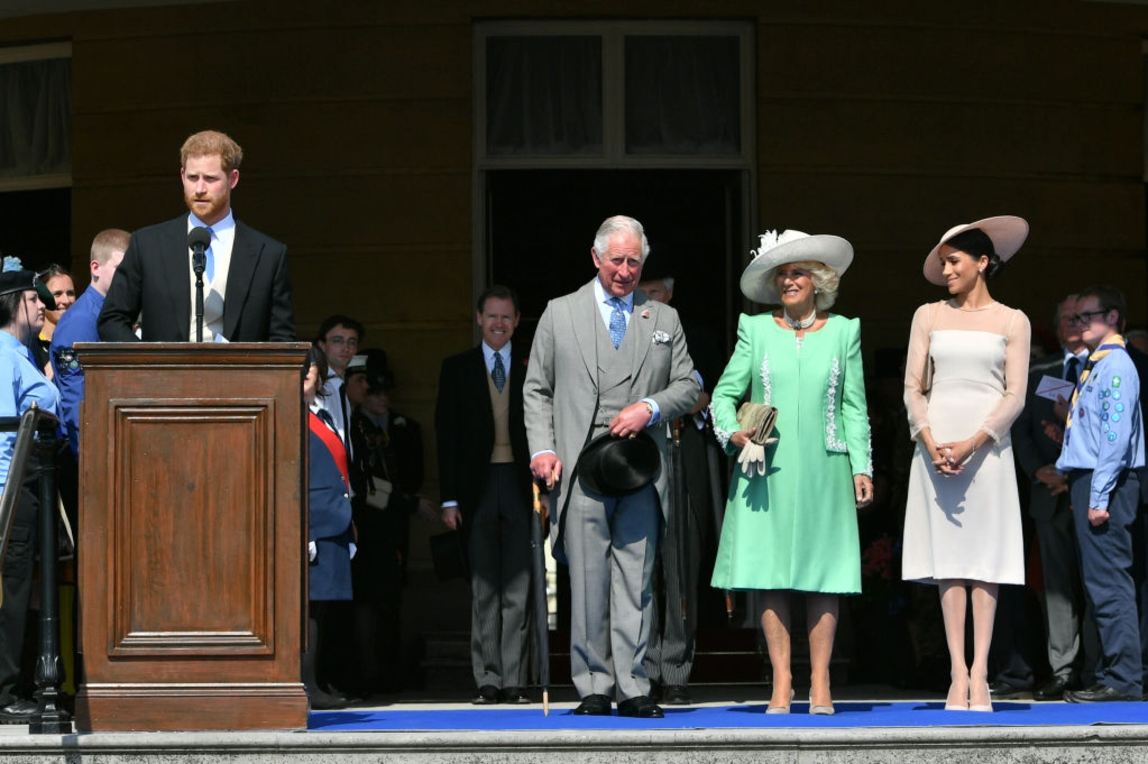 LONDON, ENGLAND - MAY 22: Prince Harry, Duke of Sussex speaks as Prince Charles, Prince of Wales, Camilla, Duchess of Cornwall and Meghan, Duchess of Sussex listen during The Prince of Wales' 70th Birthday Patronage Celebration held at Buckingham Palace on May 22, 2018 in London, England. (Photo by Dominic Lipinski - Pool/Getty Images)