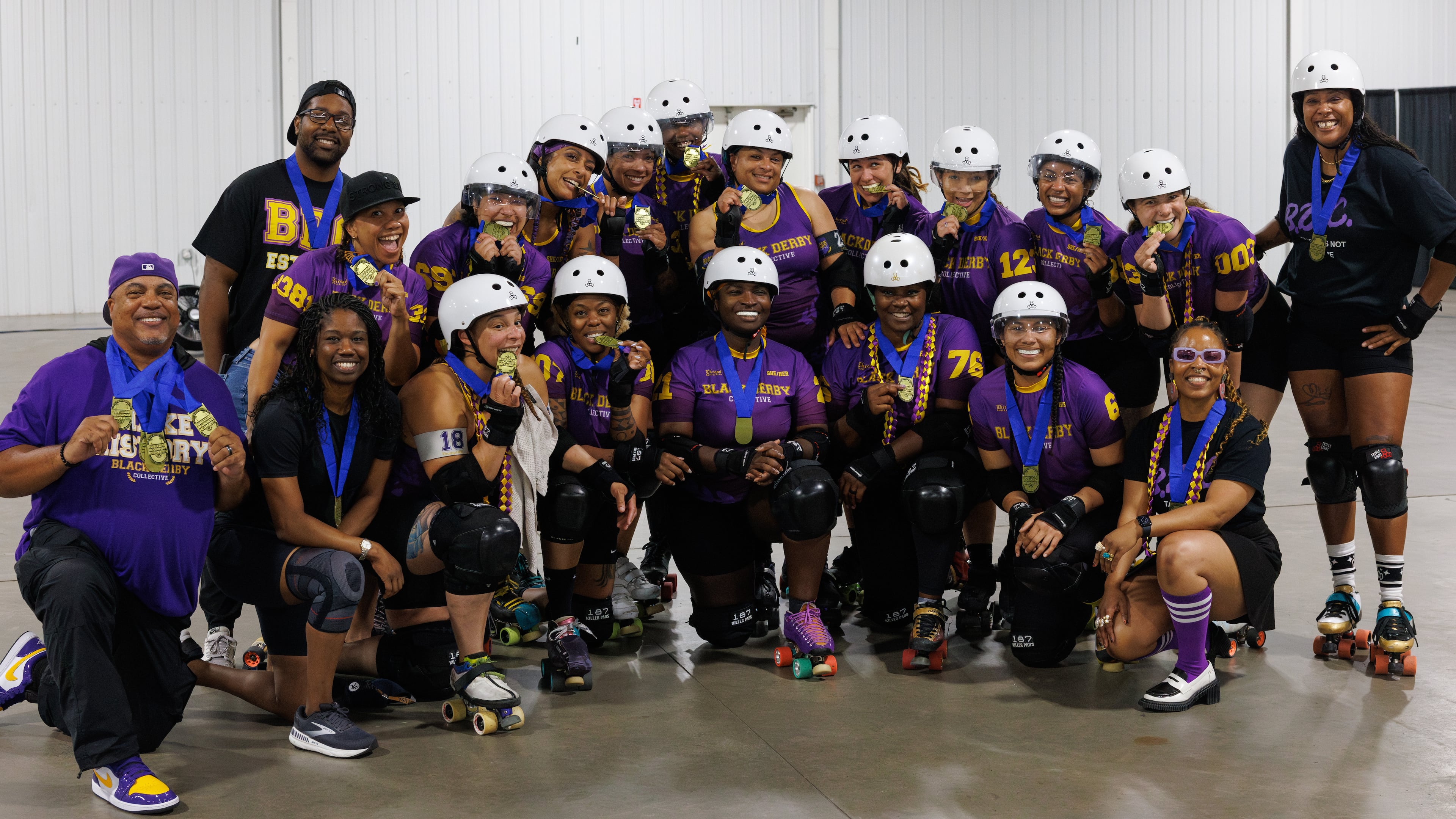 Members of the Black Derby Collective show off the gold medals they earned at playoffs in Columbia, South Carolina in May 2026. The team was sanctioned by the Women's Flat Track Derby Association in September 2025, and began competing in January 2026. This fall the team will compete in the global championships in Sweden. (Courtesy of Ethan Trewhitt)