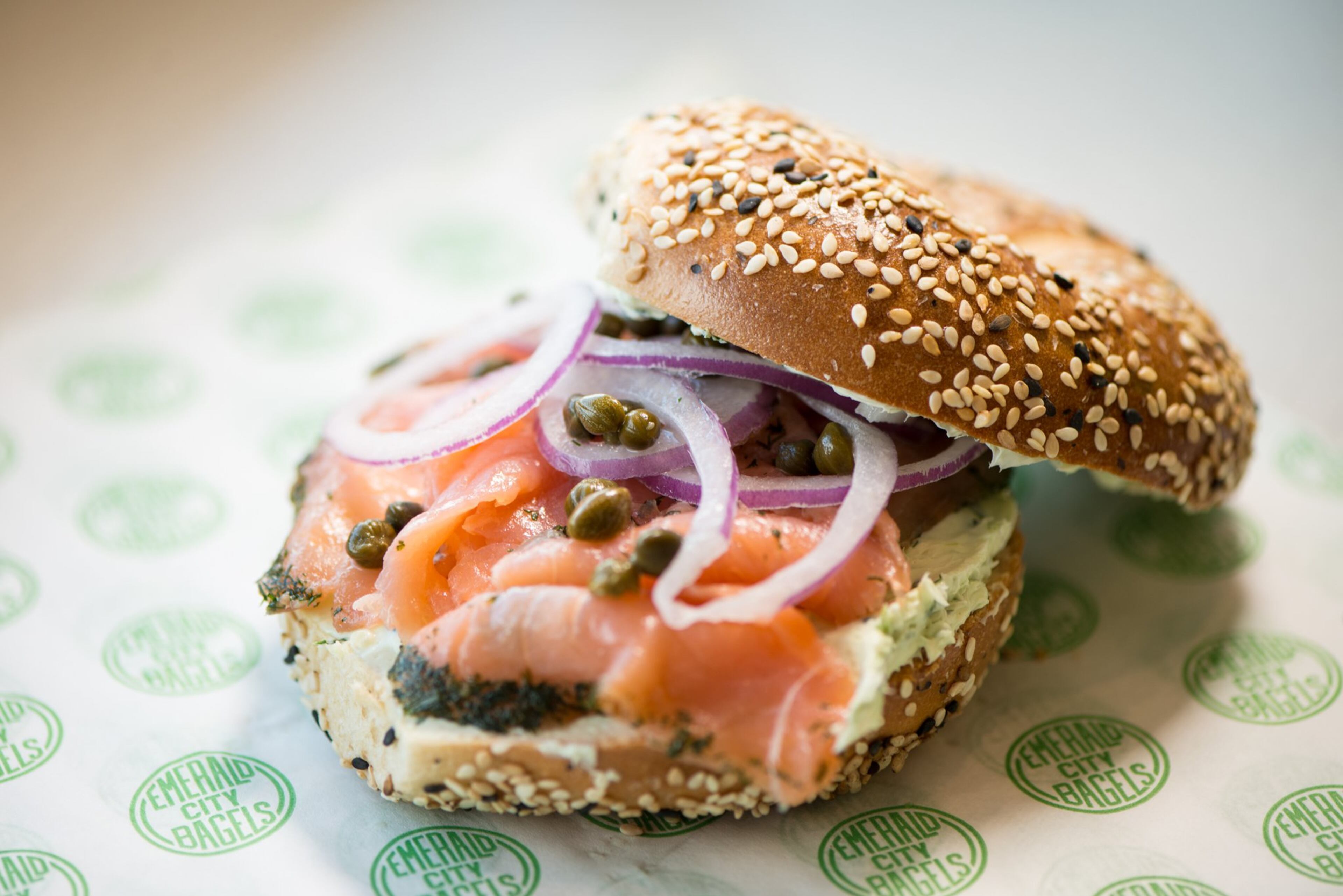 Sesame Bagel with Gravlax, Capers, Red Onion, and Dill Cream Cheese. Photo credit- Mia Yakel.