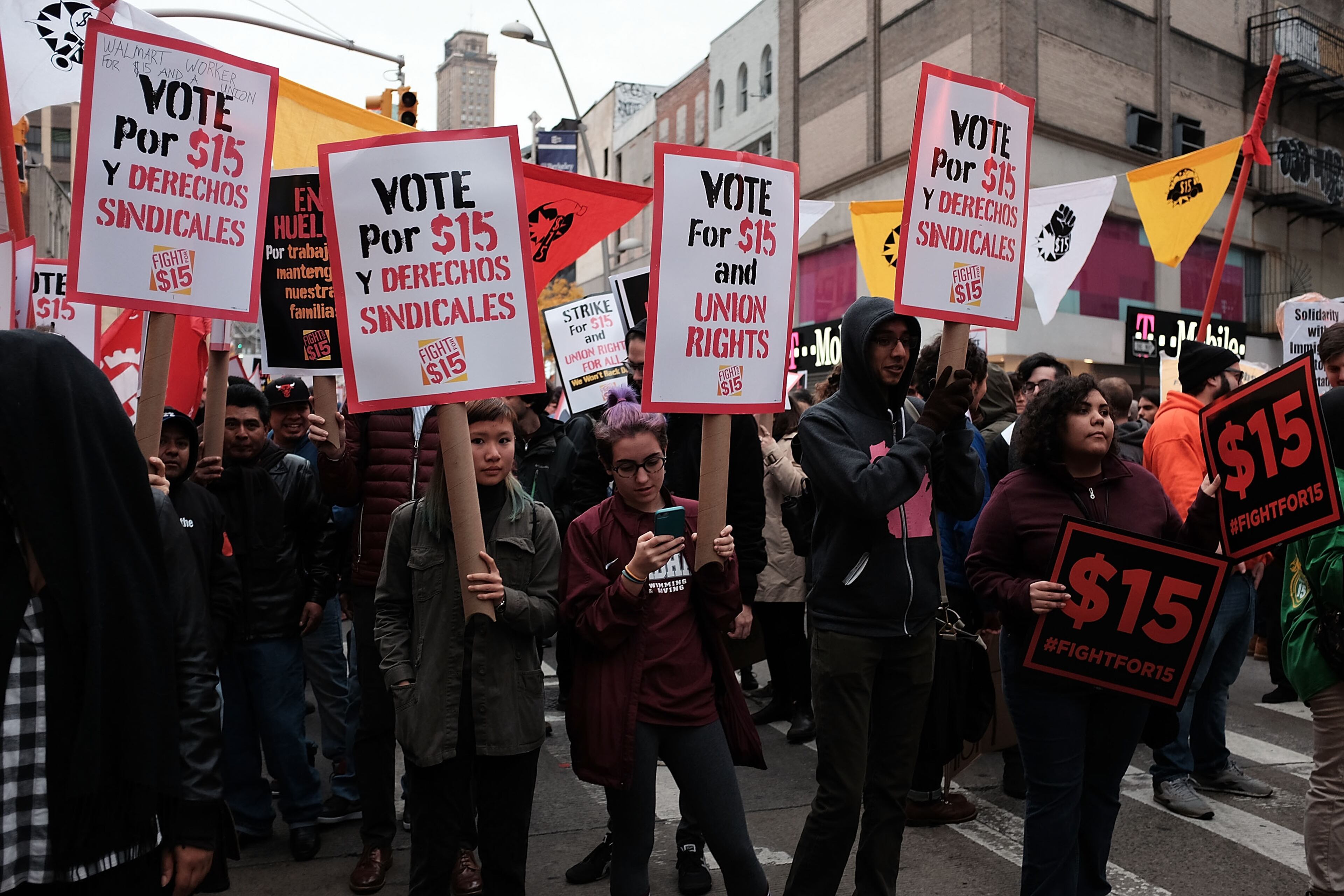 NEW YORK, NY - NOVEMBER 10: Low wage workers and supporters protest for a $15 an hour minimum wage on November 10, 2015 in New York, United States. In what organizers are calling a National Day of Action for $15 and hour minimum wage, thousands of people took to the streets across the country to stage protests in front of businesses that are paying some of their workers the minimum wage. Home care workers, employees in retail and fast food restaurants say that the current minimum is not a living wage. (Photo by Spencer Platt/Getty Images)