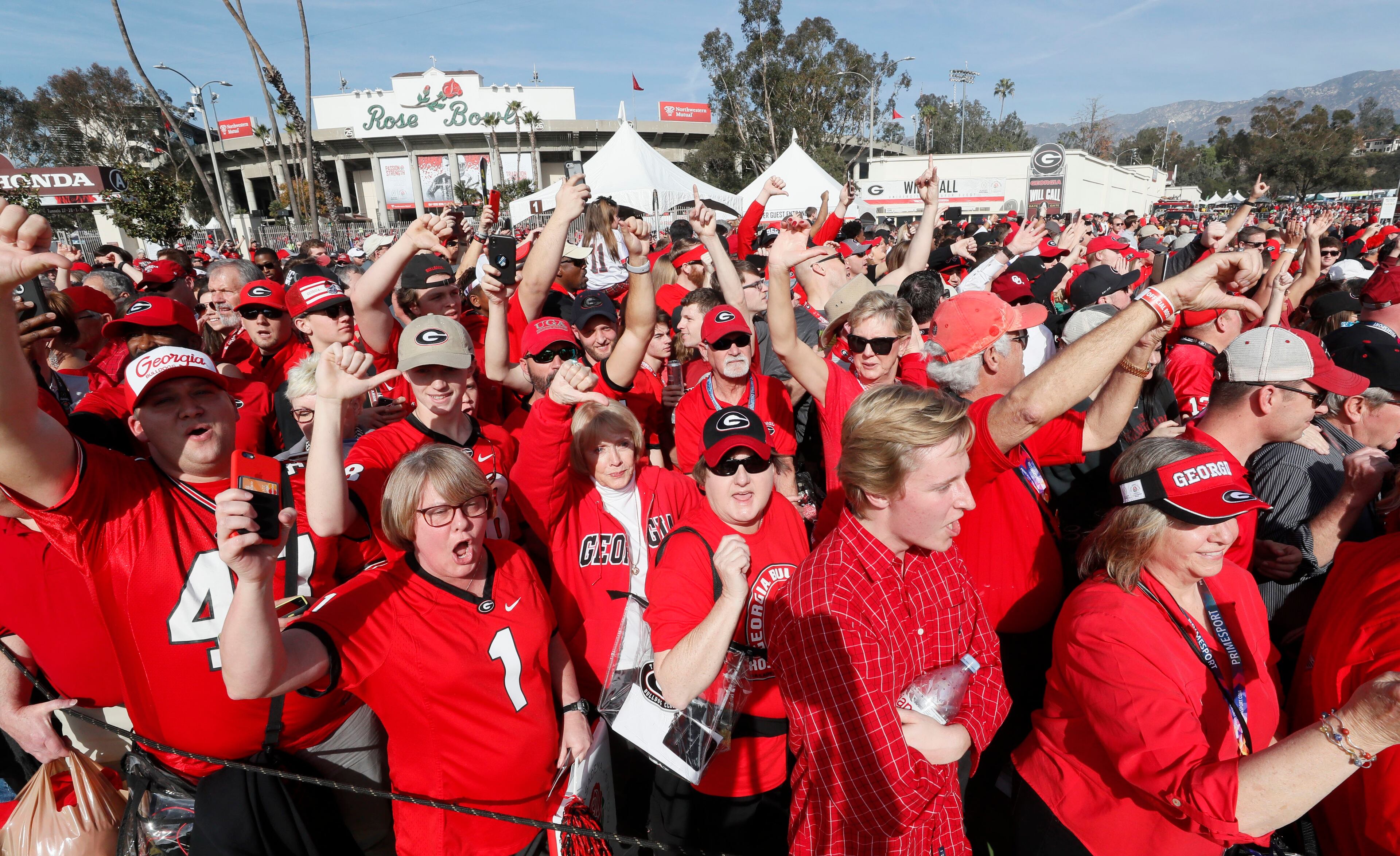 1/1/18 - Pasadena - Fans cheer as they wait for the Georgia team bus to arrive at the College Football Playoff Semifinal at the Rose Bowl Game on Monday, January 1, 2018, in Pasadena. BOB ANDRES /BANDRES@AJC.COM